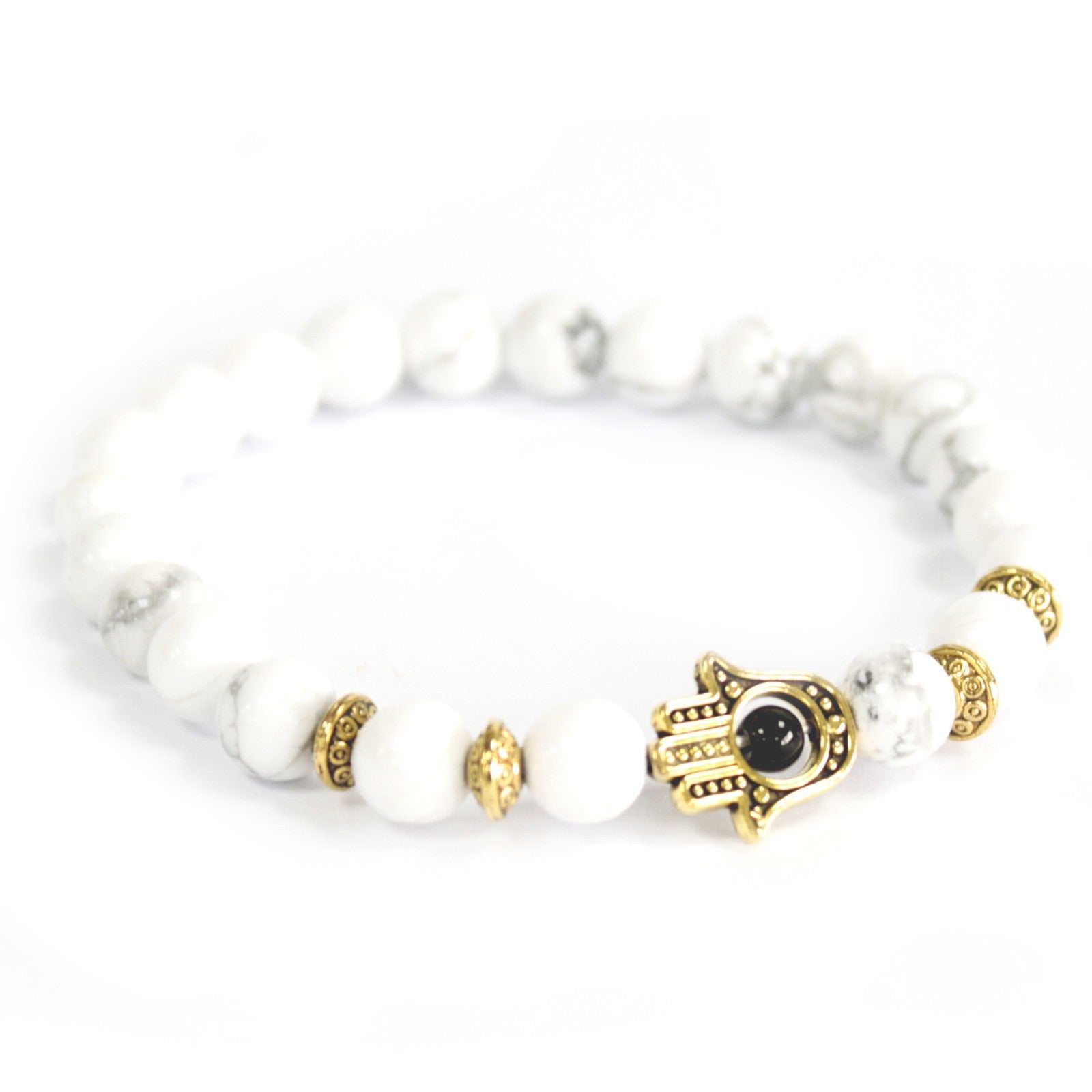 Unisex Handcrafted Boho Gemstone Bracelet - White Howlite Gemstones / Gold Hamsa product packaging on clean background from Quintessential Holistic Health Ltd