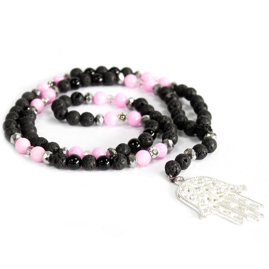 Handcrafted Boho Gemstone Necklace - Pink Gemstones and Black Lava Gemstones - Silver Hamsa product packaging on clean background from Quintessential Holistic Health Ltd