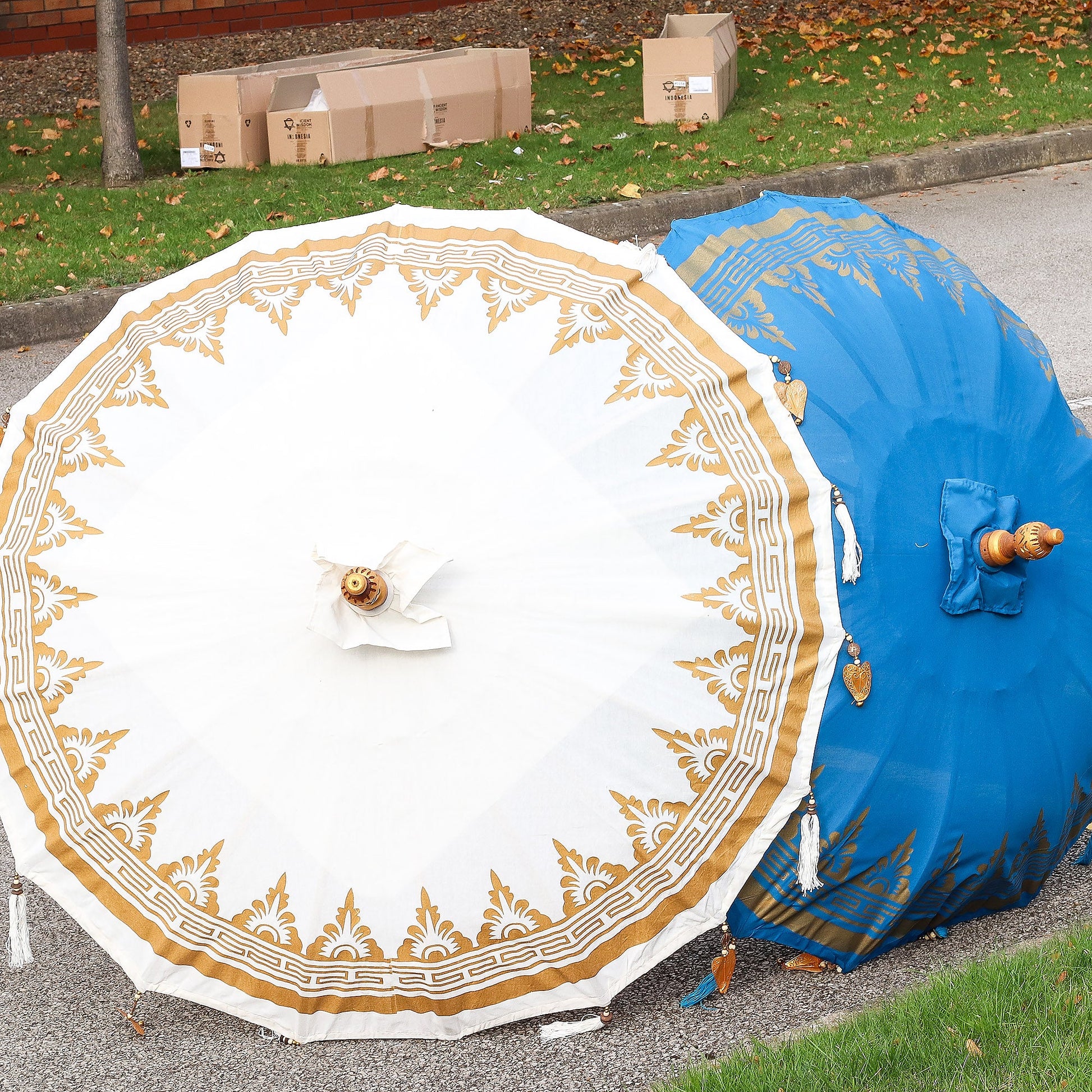 Handcrafted Decorative Parasol - Medium - Natural, viewed from above with a gold border and white central ornament by Quintessential Holistic Health Ltd