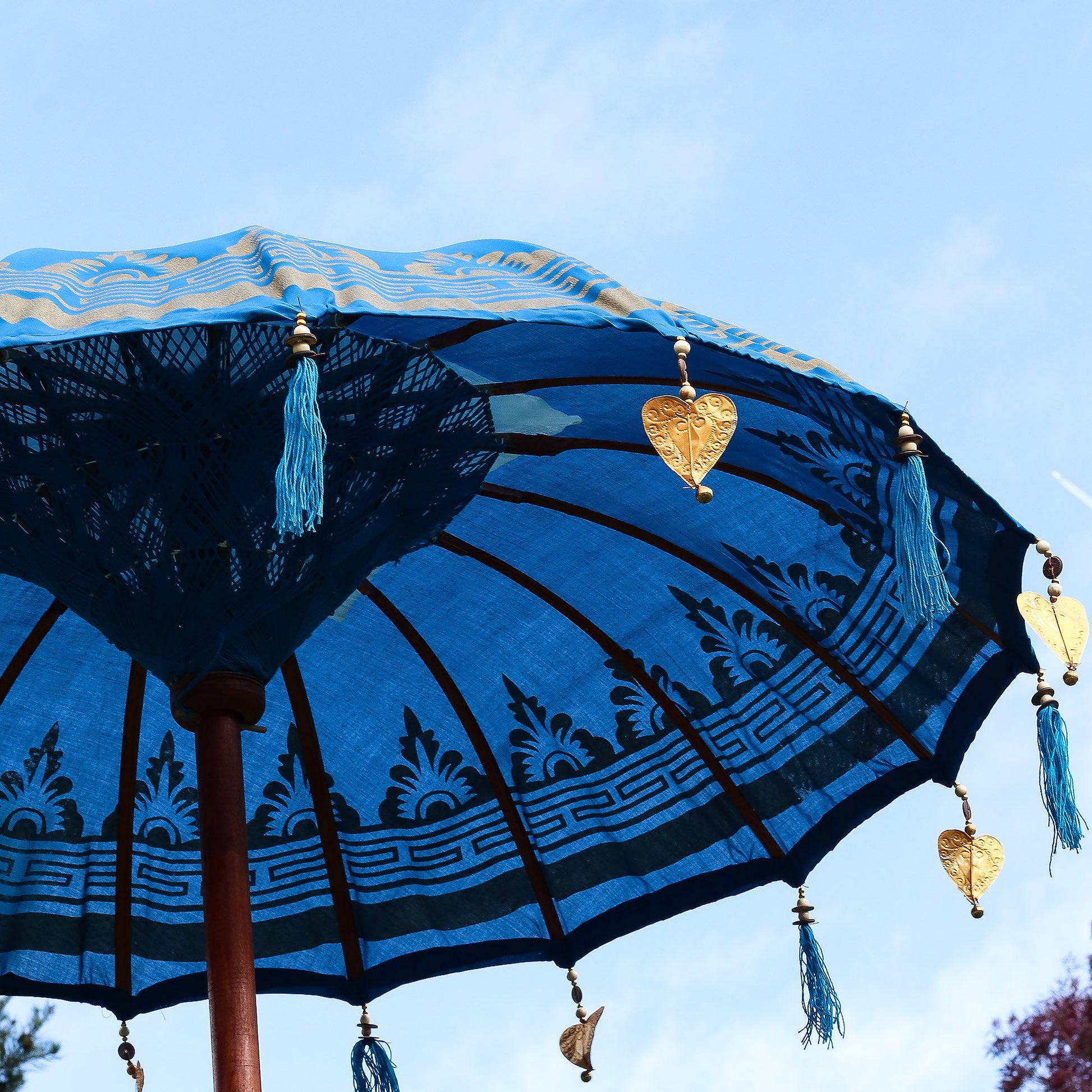 Handcrafted Decorative Parasol - Medium - Turquoise with dark floral border, black ribs, blue tassel and gold heart ornament by Quintessential Holistic Health Ltd