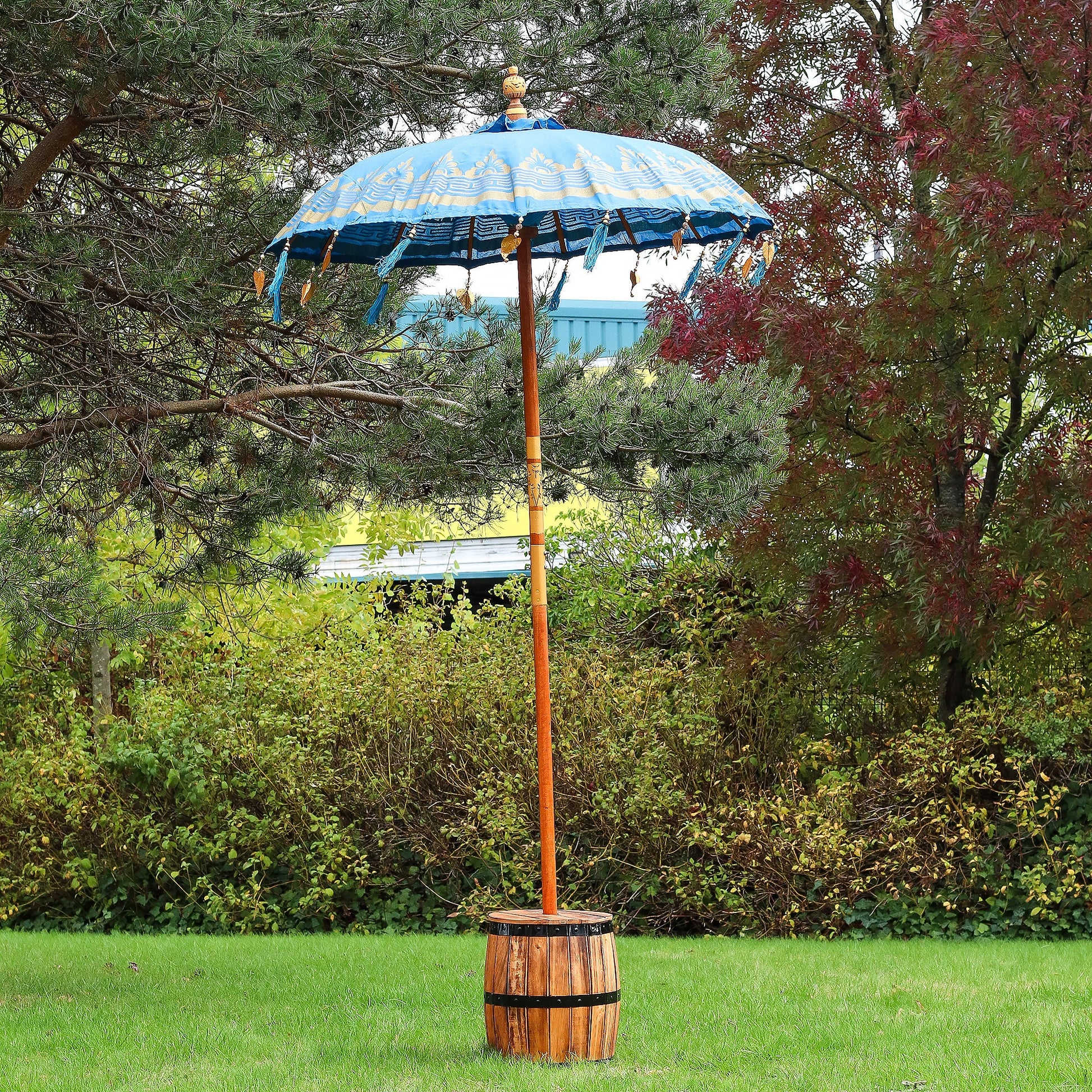 Handcrafted Decorative Parasol - Medium - Turquoise with blue canopy and dangling ornaments, standing in a wooden base by Quintessential Holistic Health Ltd
