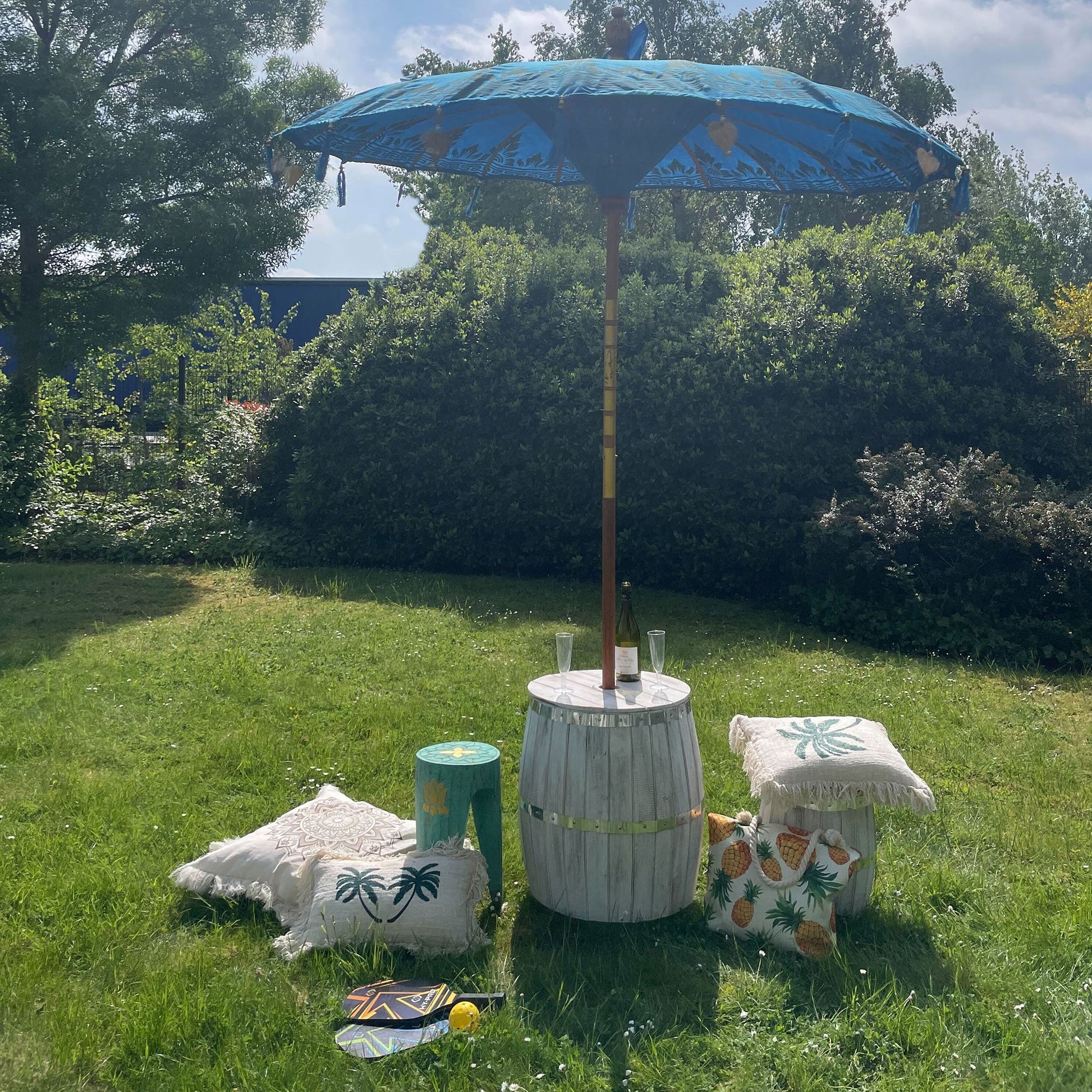 Handcrafted Decorative Parasol - Large - Turquoise with blue canopy on a tall pole, displayed beside small covered stools by Quintessential Holistic Health Ltd