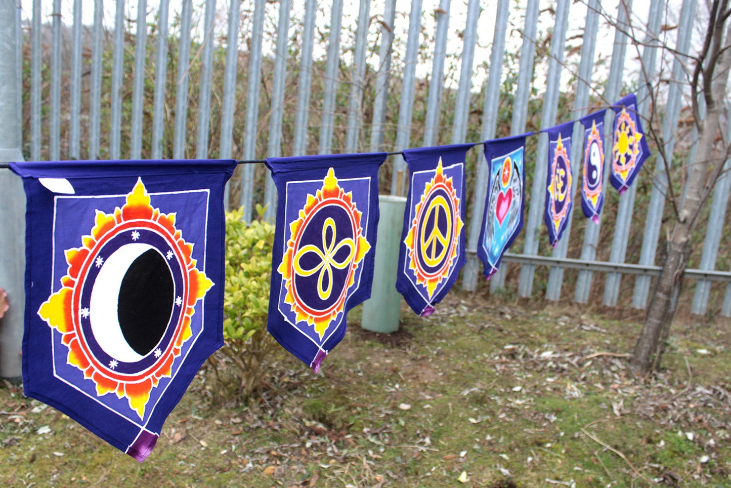 Handmade Batik Seven Flag Banner - Love in the Centre product packaging on clean background from Quintessential Holistic Health Ltd