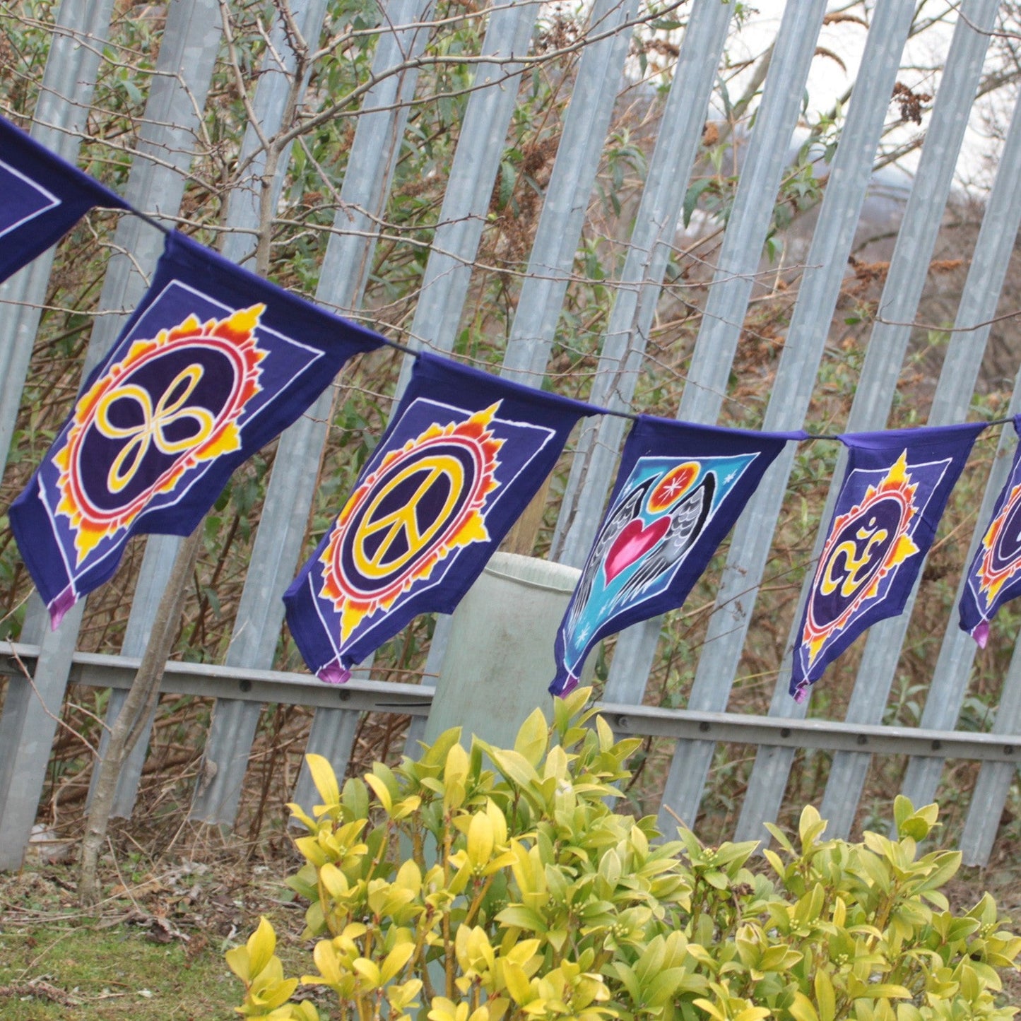 Handmade Batik Seven Flag Banner - Love in the Centre product packaging on clean background from Quintessential Holistic Health Ltd