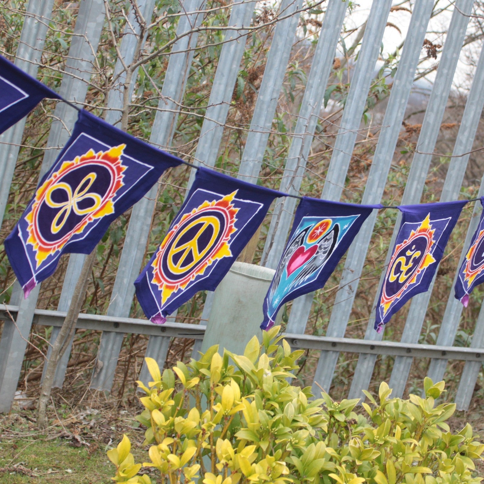 Handmade Batik Seven Flag Banner - Love in the Centre product packaging on clean background from Quintessential Holistic Health Ltd