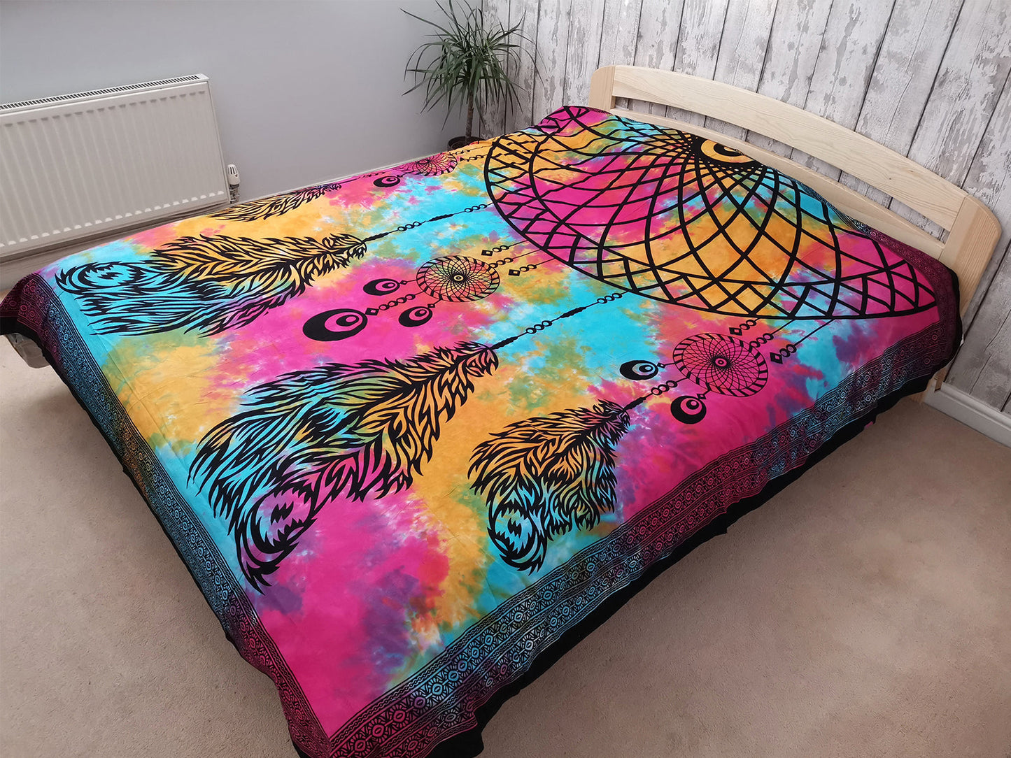 Double Cotton Wall Hanging or Bedspread - Dreamcatcher spread over a bed with feathers across the lower half by Quintessential Holistic Health Ltd