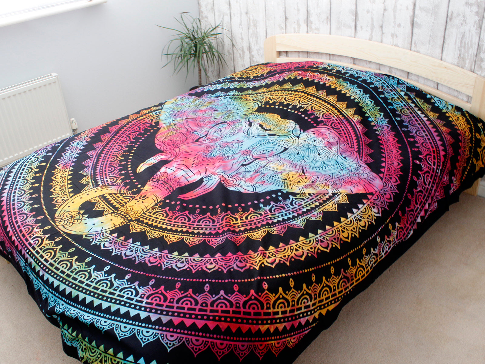 Double Cotton Wall Hanging or Bedspread - Elephant Head spread across a bed with the elephant motif centred by Quintessential Holistic Health Ltd