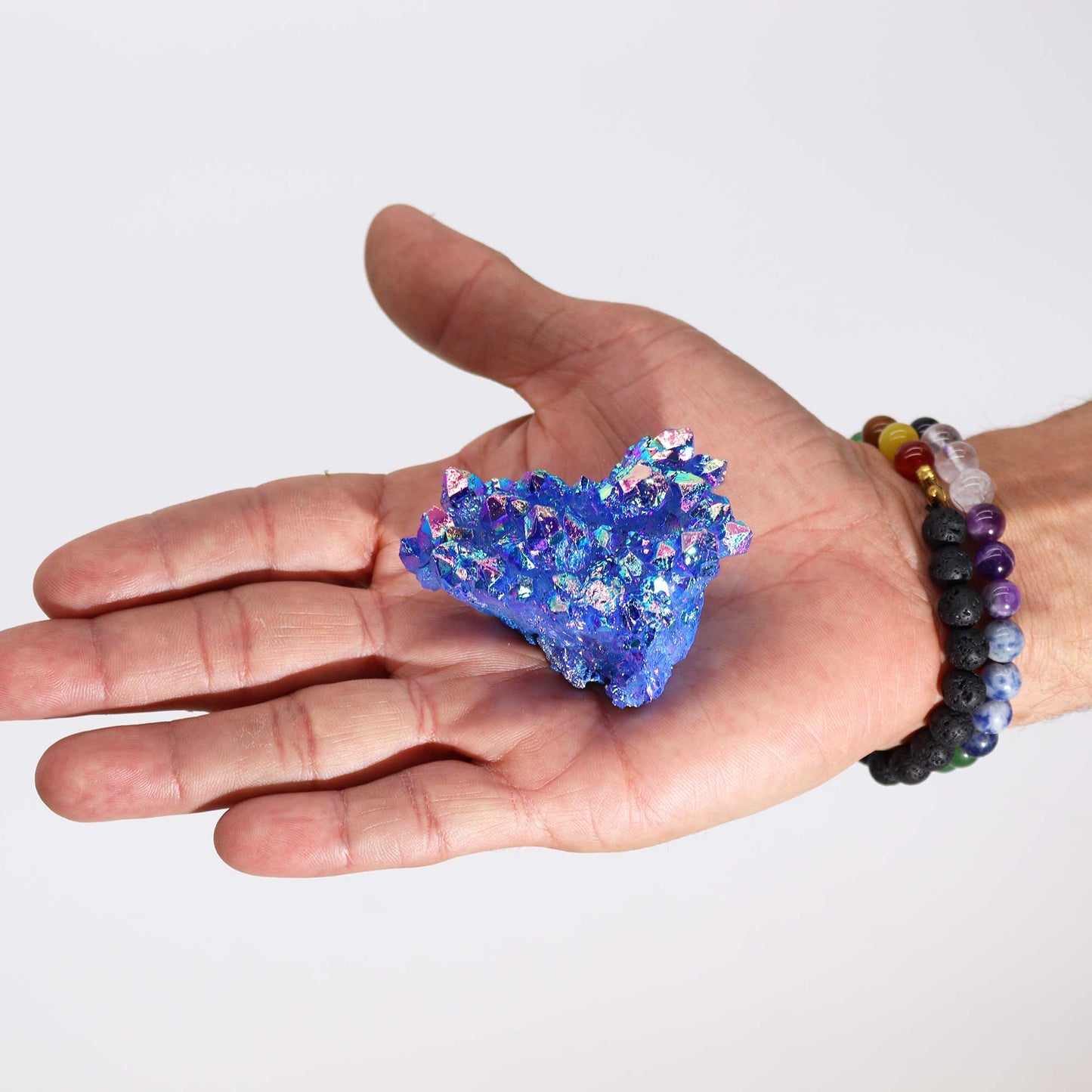 Handcrafted Natural Crystal Quartz - Medium / Aura Aqua Halo product packaging on clean background from Quintessential Holistic Health Ltd