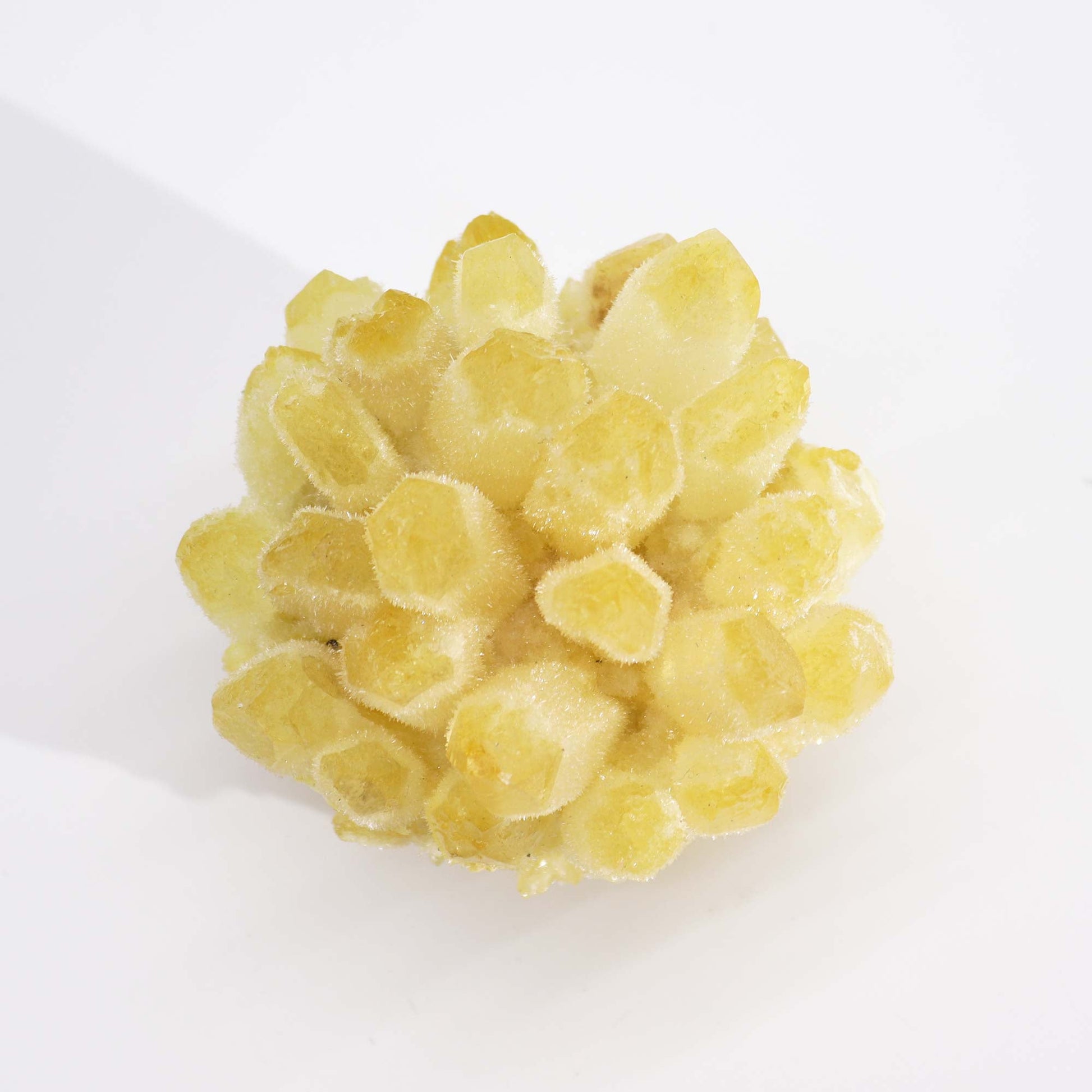 Handcrafted Natural Crystal Quartz - Yellow Ghost product packaging on clean background from Quintessential Holistic Health Ltd