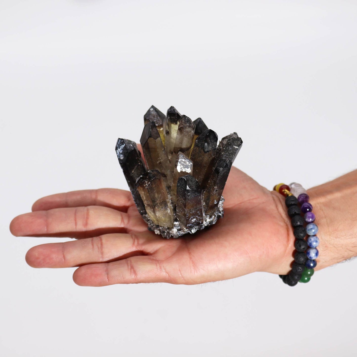 Handcrafted Natural Crystal Quartz - Smoky Ghost product packaging on clean background from Quintessential Holistic Health Ltd