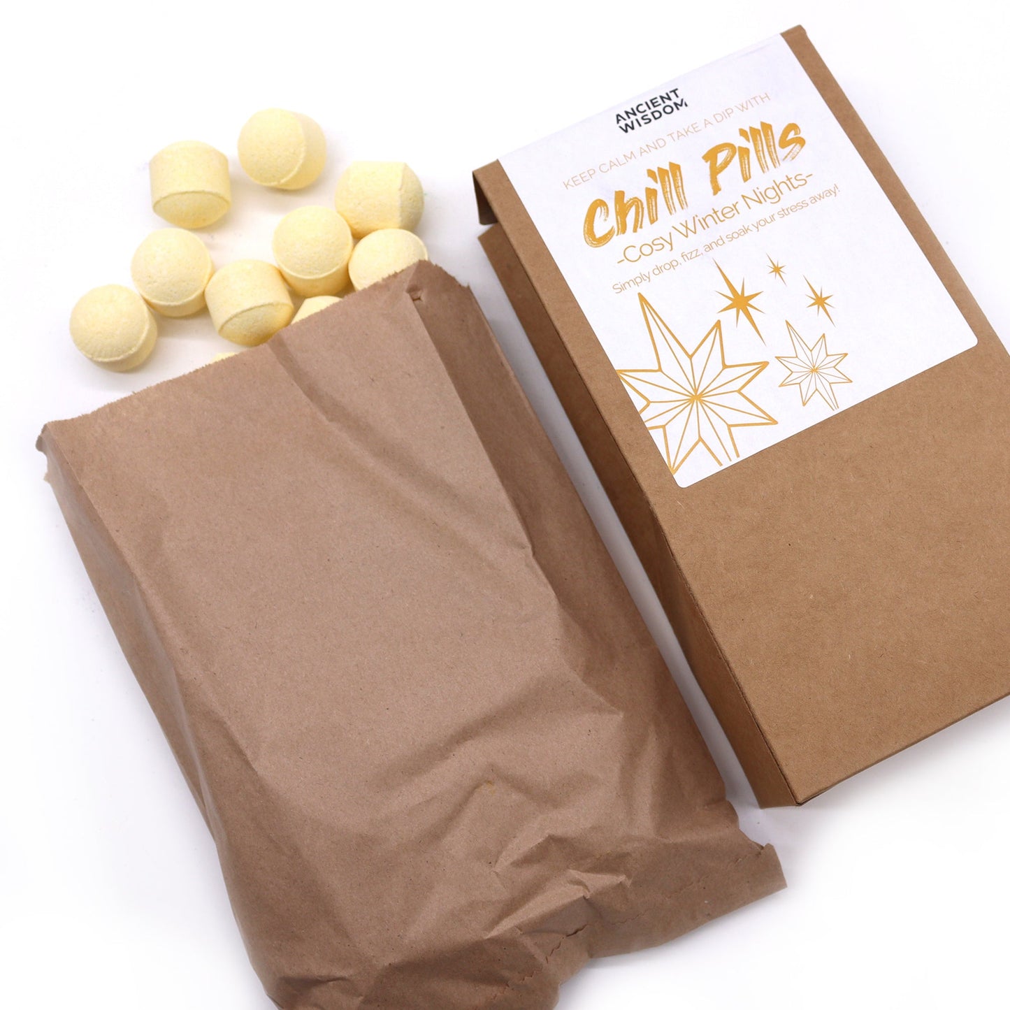 Vegan Bath Bomb Chill Pills - Cosy Winter Nights - 350g, open kraft box beside a paper bag and scattered pale yellow tablets, by Quintessential Holistic Health Ltd