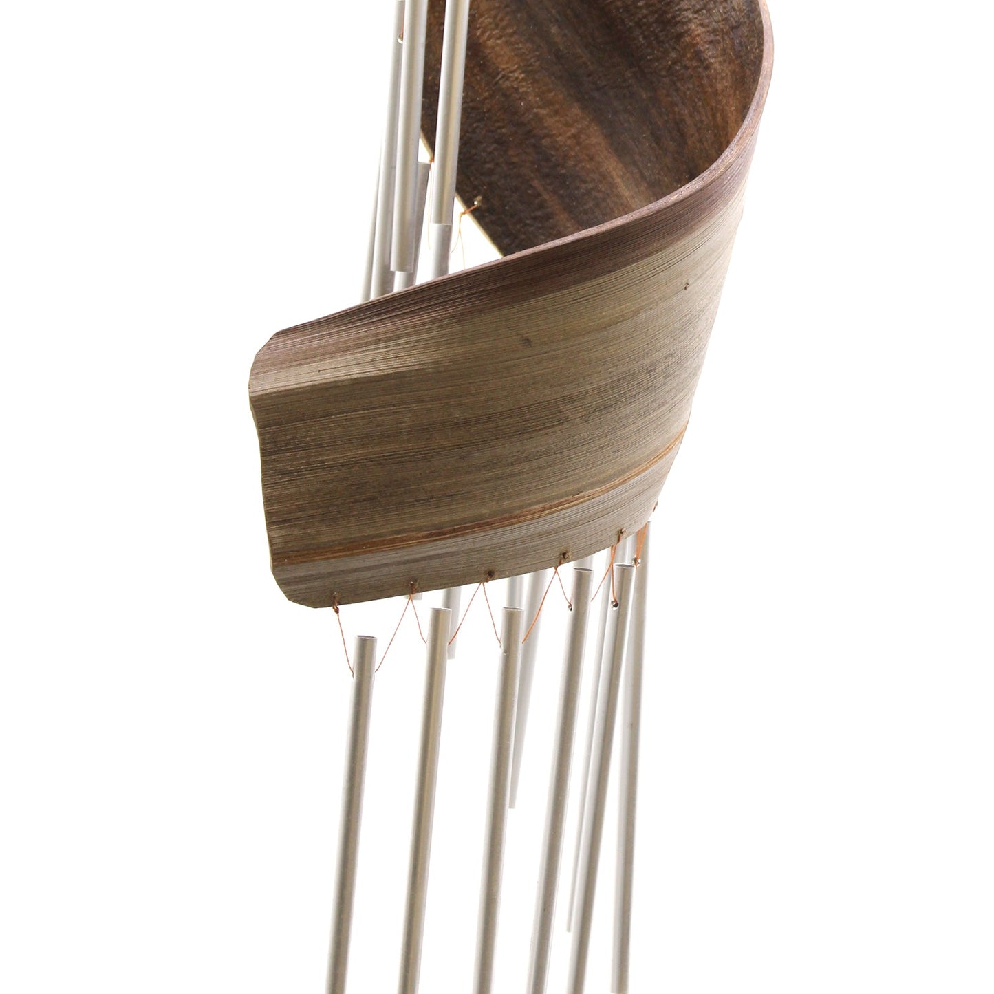 Handcrafted Coconut Leaf Wind Chime - Natural close-up showing a broad curved brown leaf around silver-tone tubes by Quintessential Holistic Health Ltd