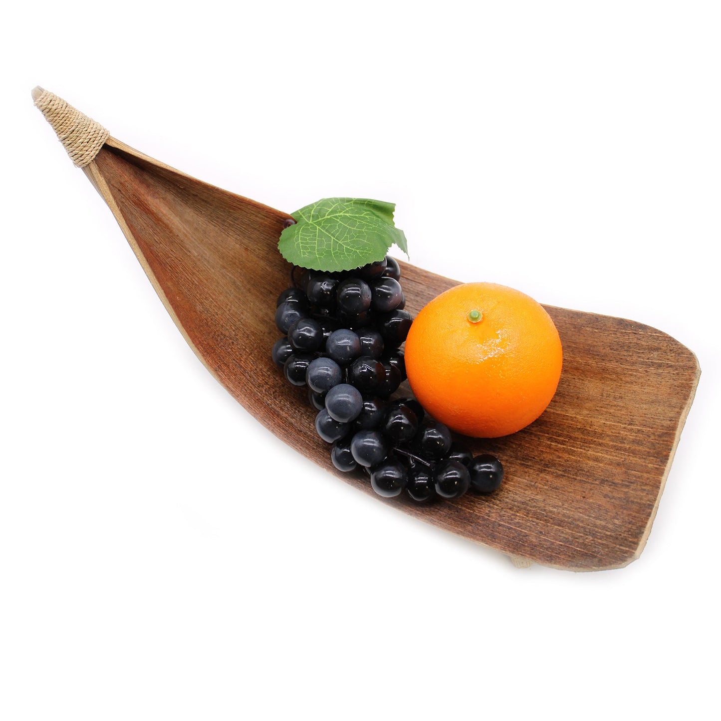 Coconut Leaf Fruit Bowl Set of 3 - Natural with one raised curved bowl holding grapes and an orange beneath a green leaf by Quintessential Holistic Health Ltd
