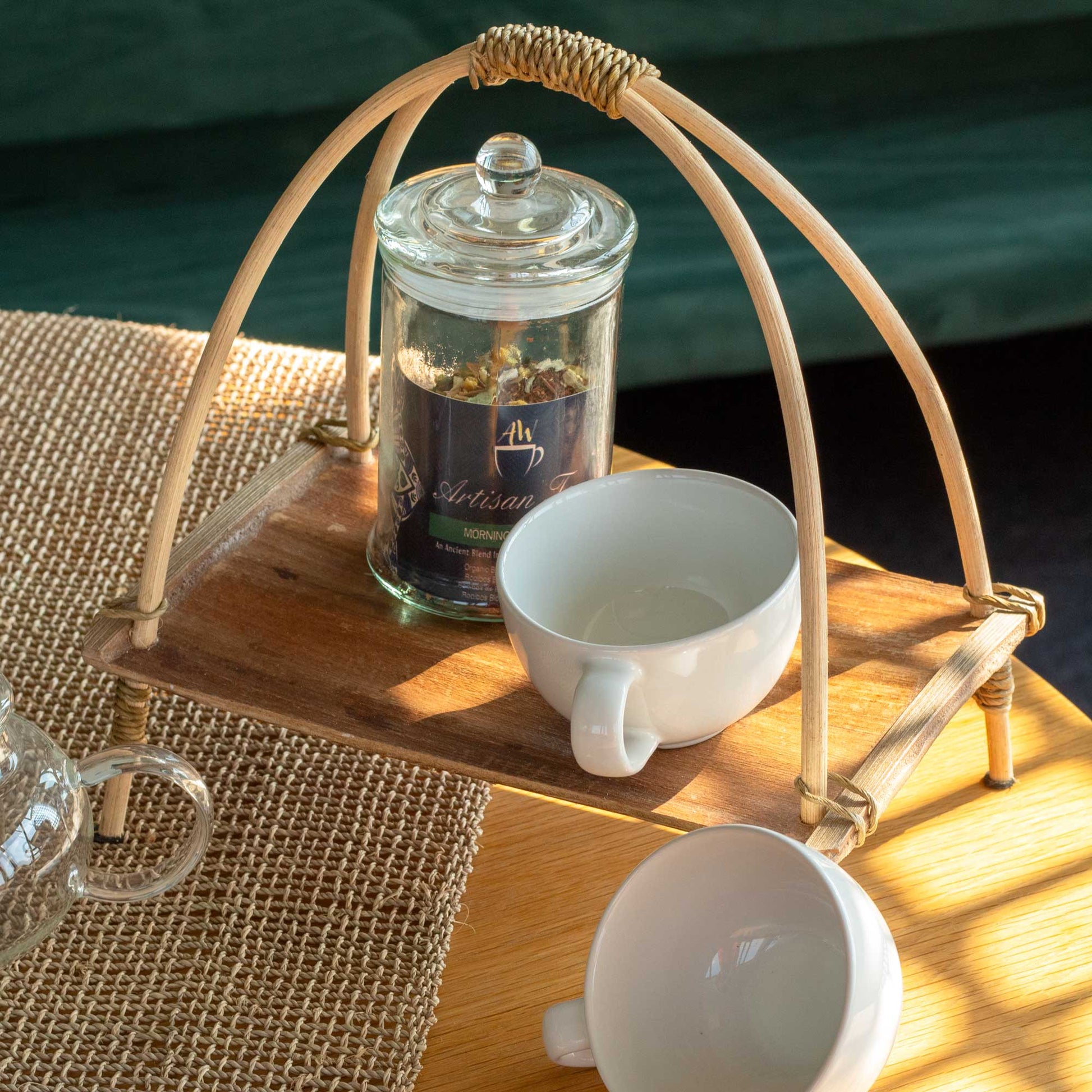 Coconut Leaf Tea Stand - Natural with a glass jar and white cup on its raised brown tray by Quintessential Holistic Health Ltd