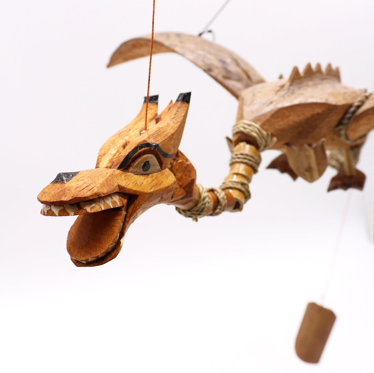 Handcrafted Coconut Shell Dragon Mobile - Natural - 37 cm showing the carved open-mouthed head, body and wings by Quintessential Holistic Health Ltd