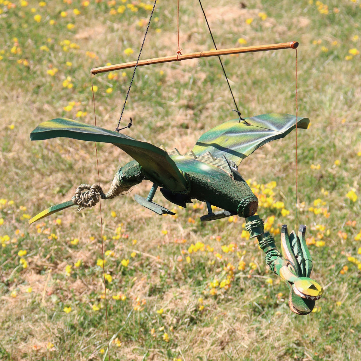 Handcrafted Green Coconut Shell Dragon Mobile - 37cm suspended beneath a wooden bar with outstretched wings by Quintessential Holistic Health Ltd