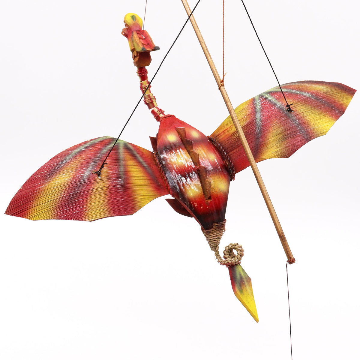 Handcrafted Coconut Shell Dragon Mobile - Red, close view of the suspended dragon with striped wings and visible hanging cords by Quintessential Holistic Health Ltd