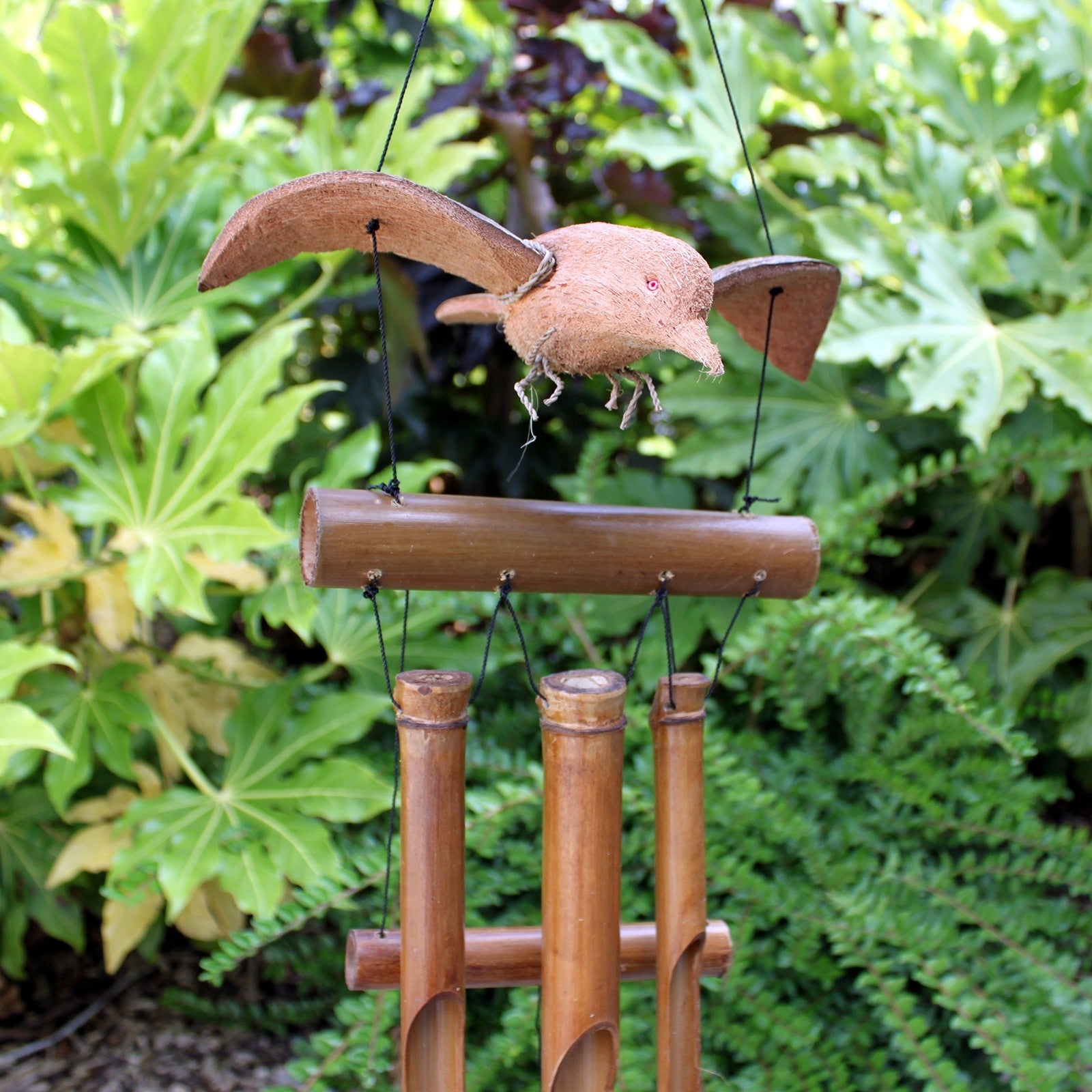 Handcrafted Coconut Shell and Bamboo Wind Chime - Blackbird, brown bird ornament above four tubular chimes by Quintessential Holistic Health Ltd