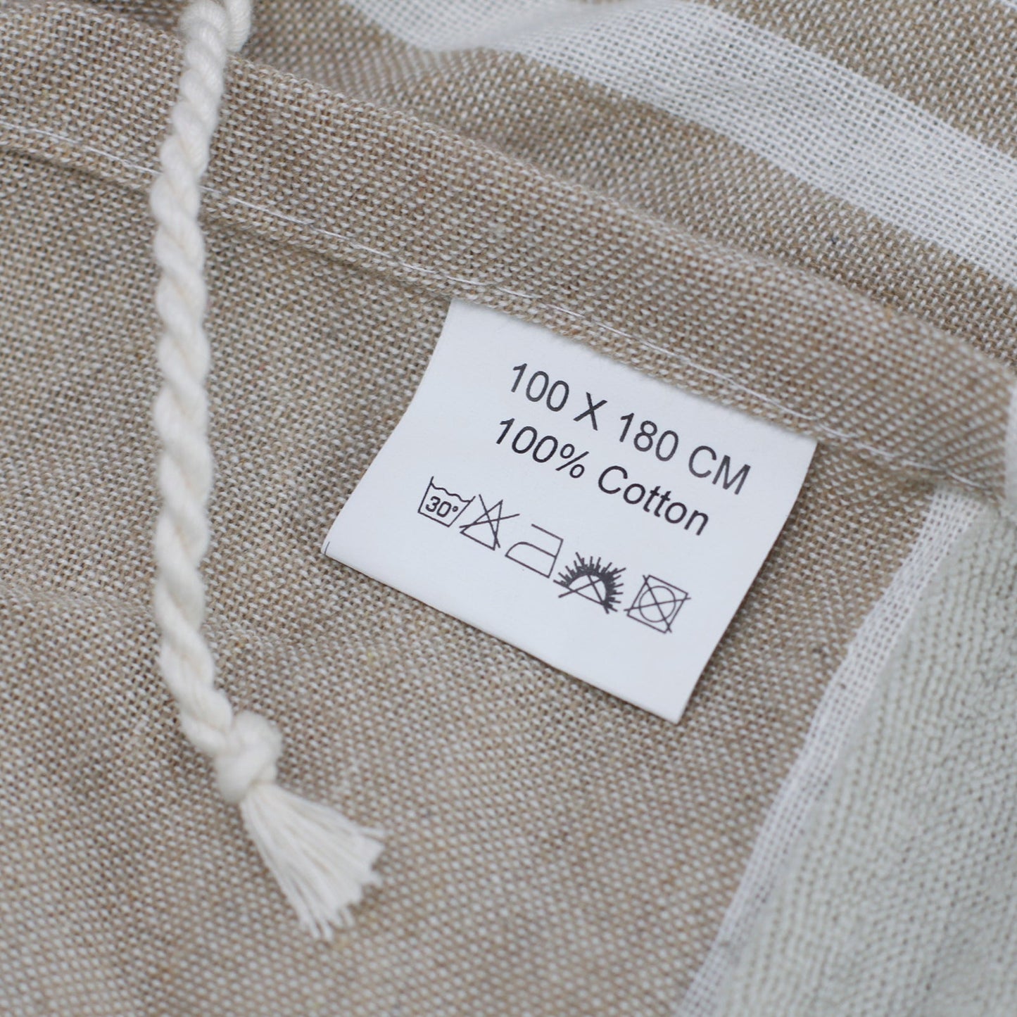 Handcrafted Cotton Pareo Towel, Wrap or Shawl - Warm Sand and White Stripes product packaging on clean background from Quintessential Holistic Health Ltd
