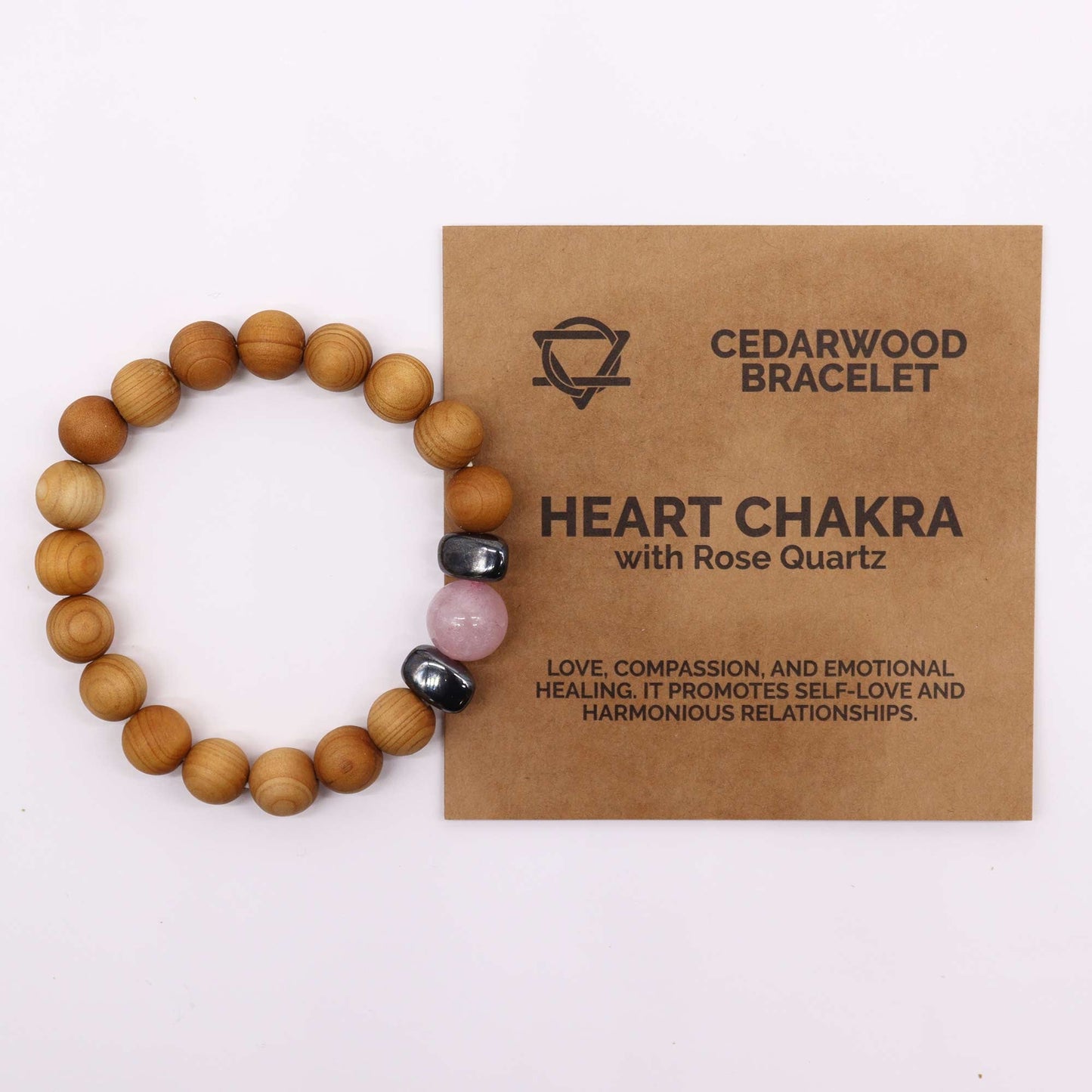 Unisex Cedarwood Heart Chakra Bracelet with Rose Quartz product packaging on clean background from Quintessential Holistic Health Ltd