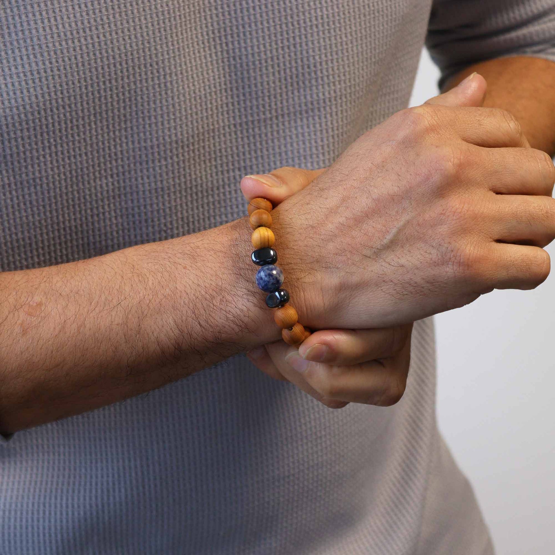 Unisex Cedarwood Throat Chakra Bracelet with Sodalite product packaging on clean background from Quintessential Holistic Health Ltd