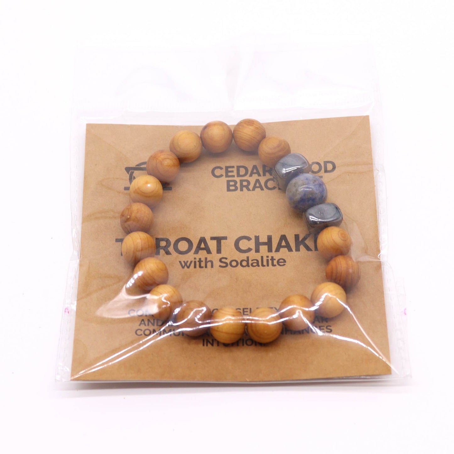 Unisex Cedarwood Throat Chakra Bracelet with Sodalite product packaging on clean background from Quintessential Holistic Health Ltd