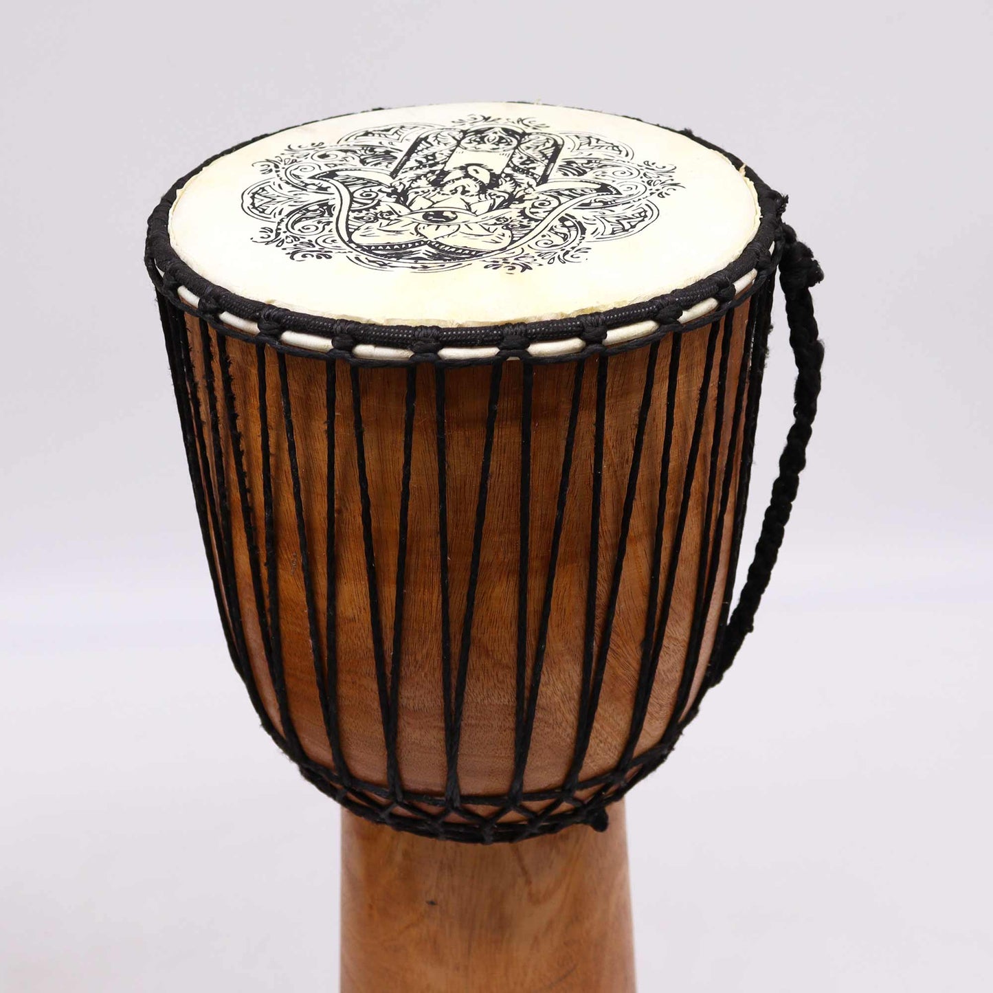 22cm Wide Top Djembe Drum - Hamsa product packaging on clean background from Quintessential Holistic Health Ltd