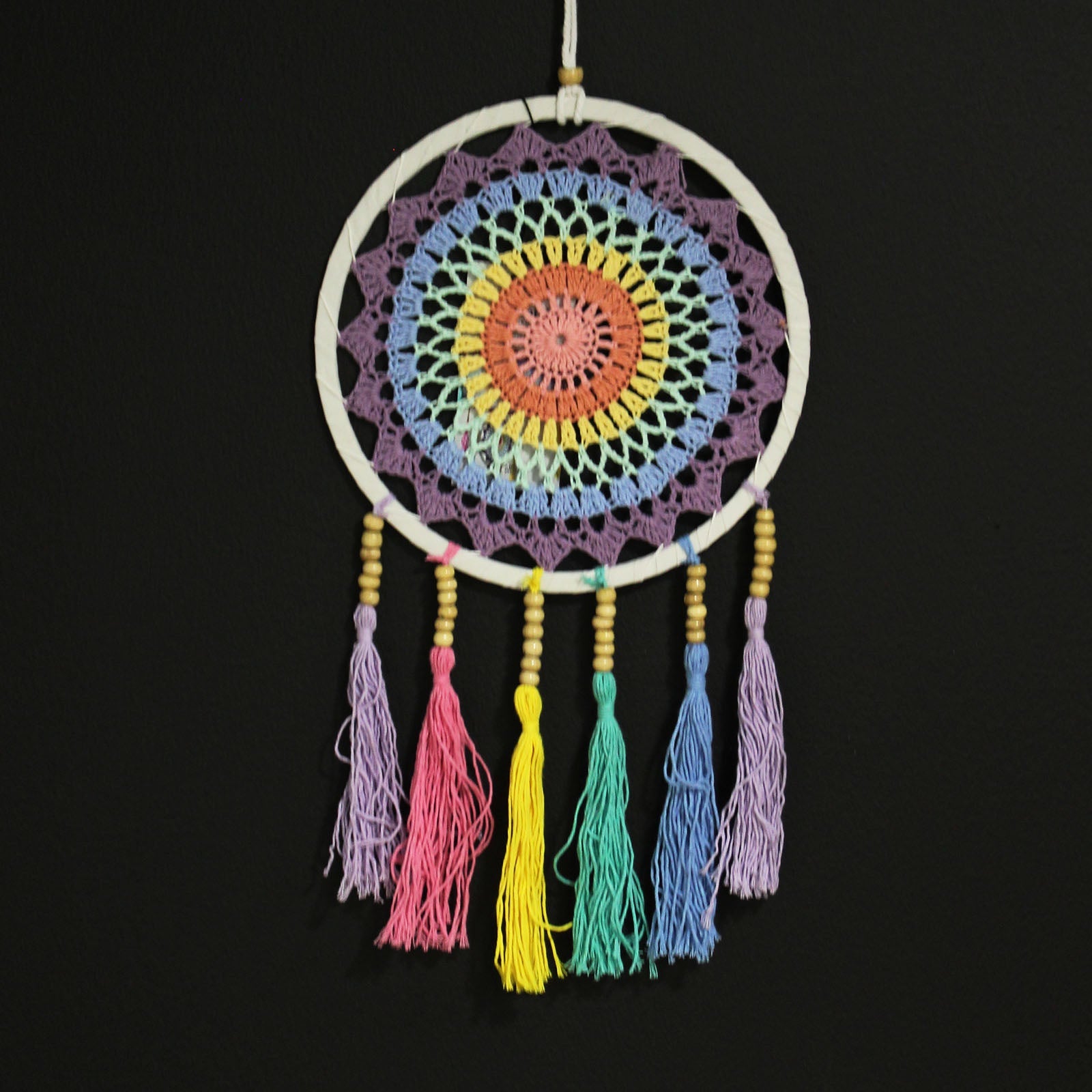 Handcrafted Rainbow Dreamcatcher - Small / Round / Pastel Colours product packaging on clean background from Quintessential Holistic Health Ltd