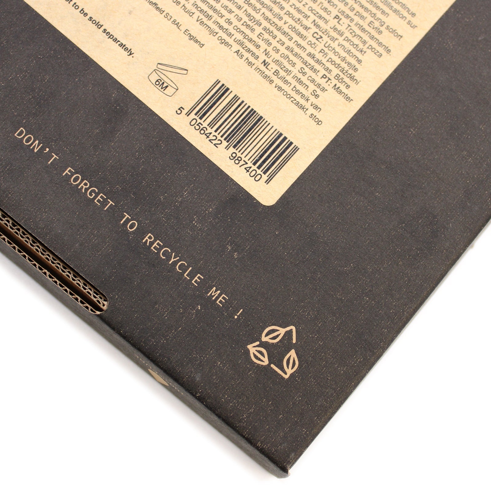 Vegan 100% Pure Aromatherapy Essential Oil Set - Top 12, close-up of a dark box corner with a barcode label and recycling symbols by Quintessential Holistic Health Ltd