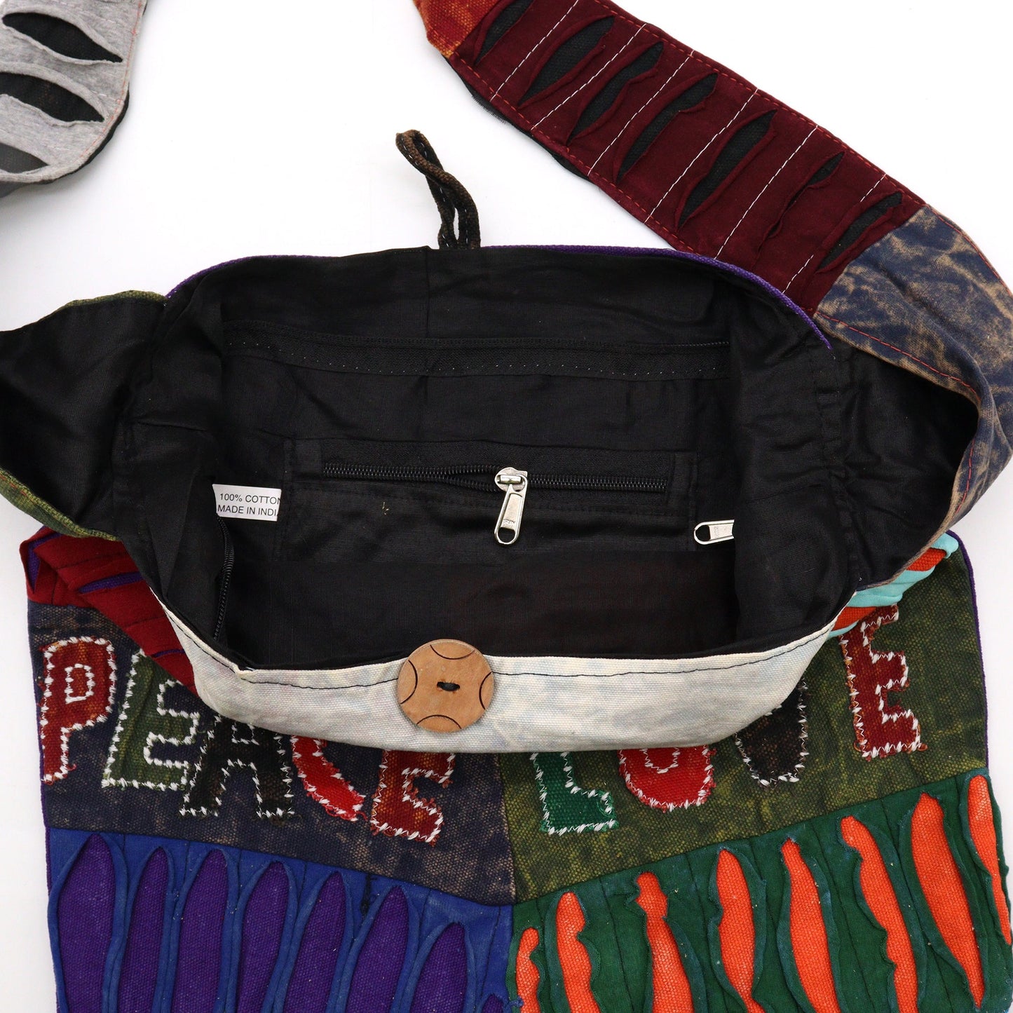 Handmade Indian Sling Bag - Peace and Love product packaging on clean background from Quintessential Holistic Health Ltd