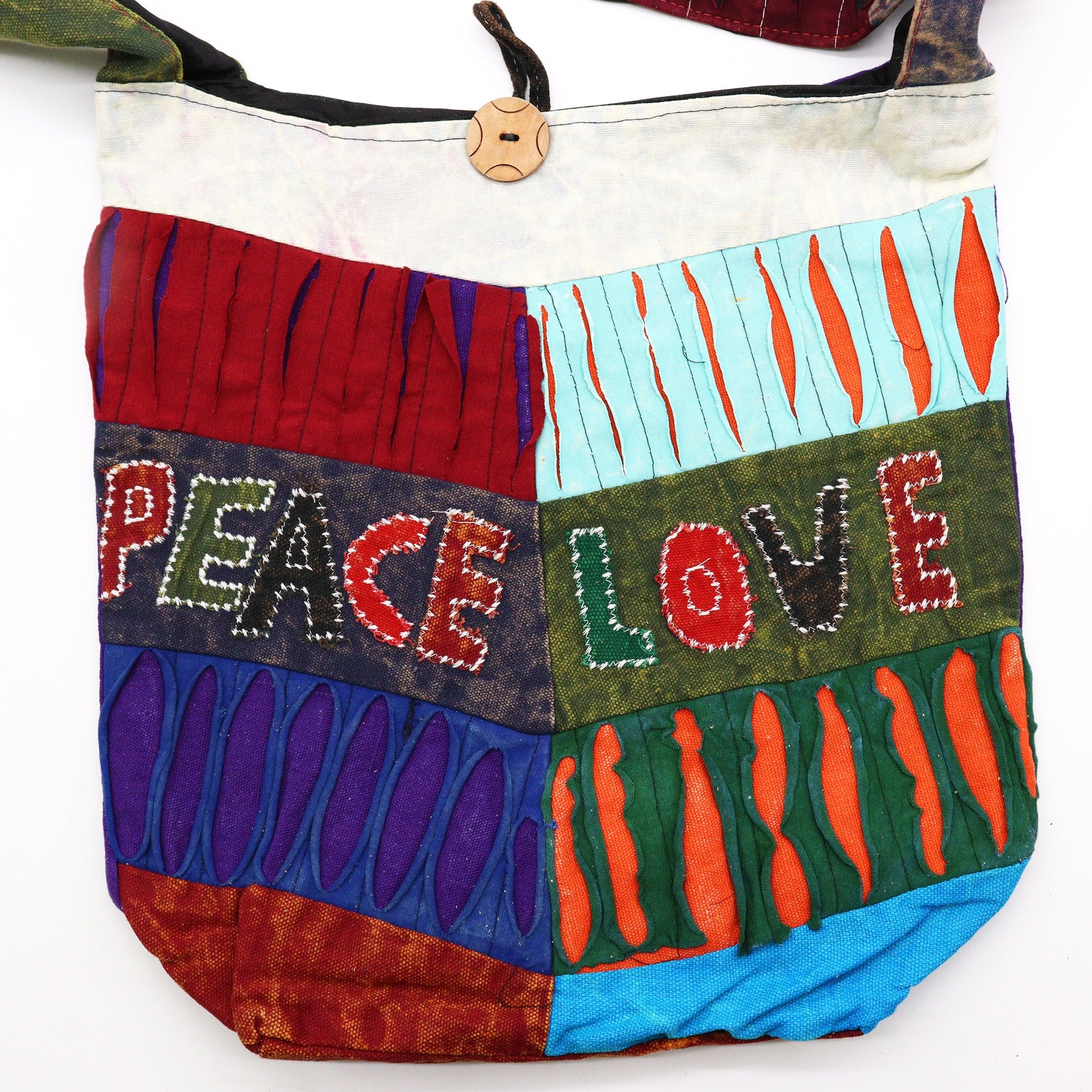 Handmade Indian Sling Bag - Peace and Love product packaging on clean background from Quintessential Holistic Health Ltd