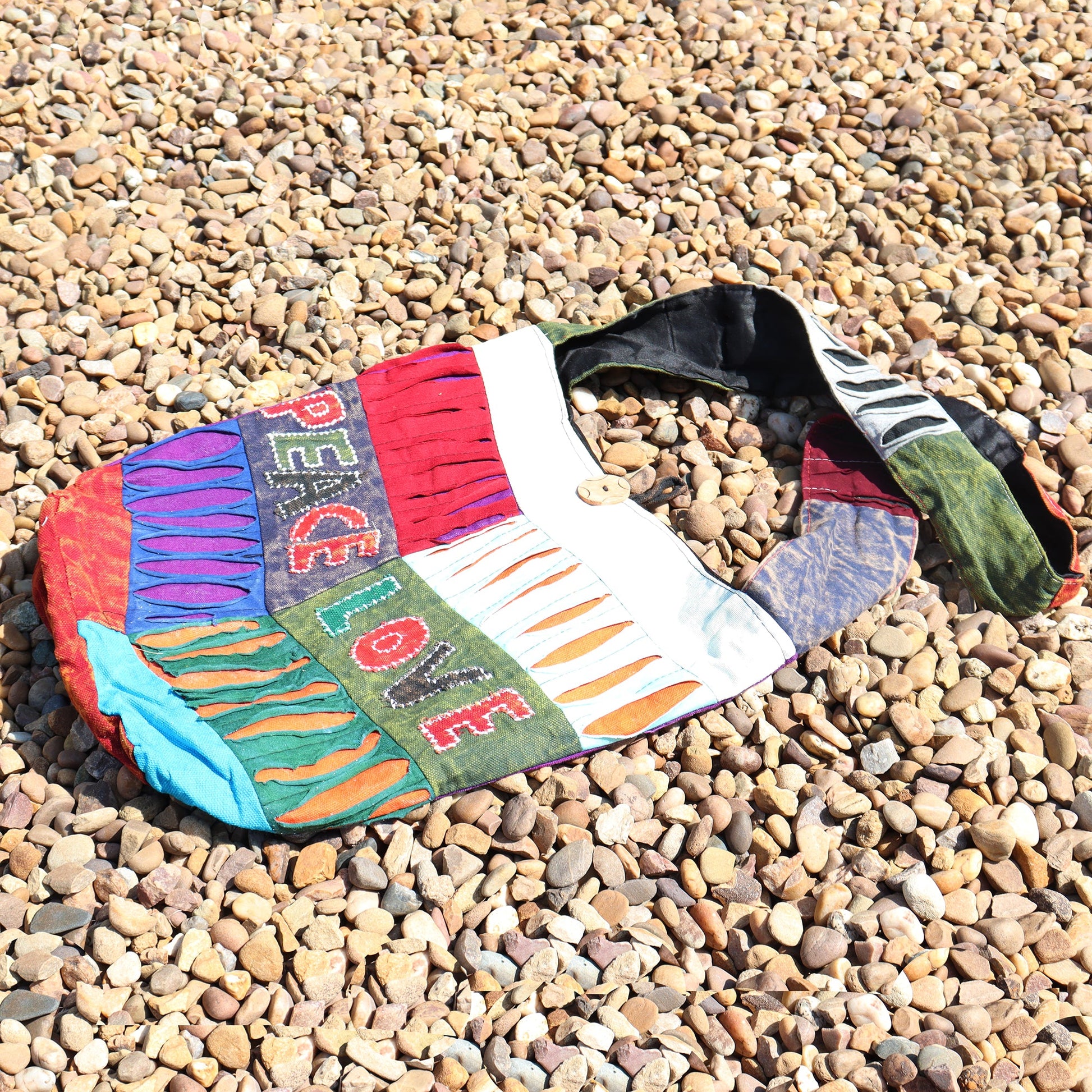 Handmade Indian Sling Bag - Peace and Love product packaging on clean background from Quintessential Holistic Health Ltd