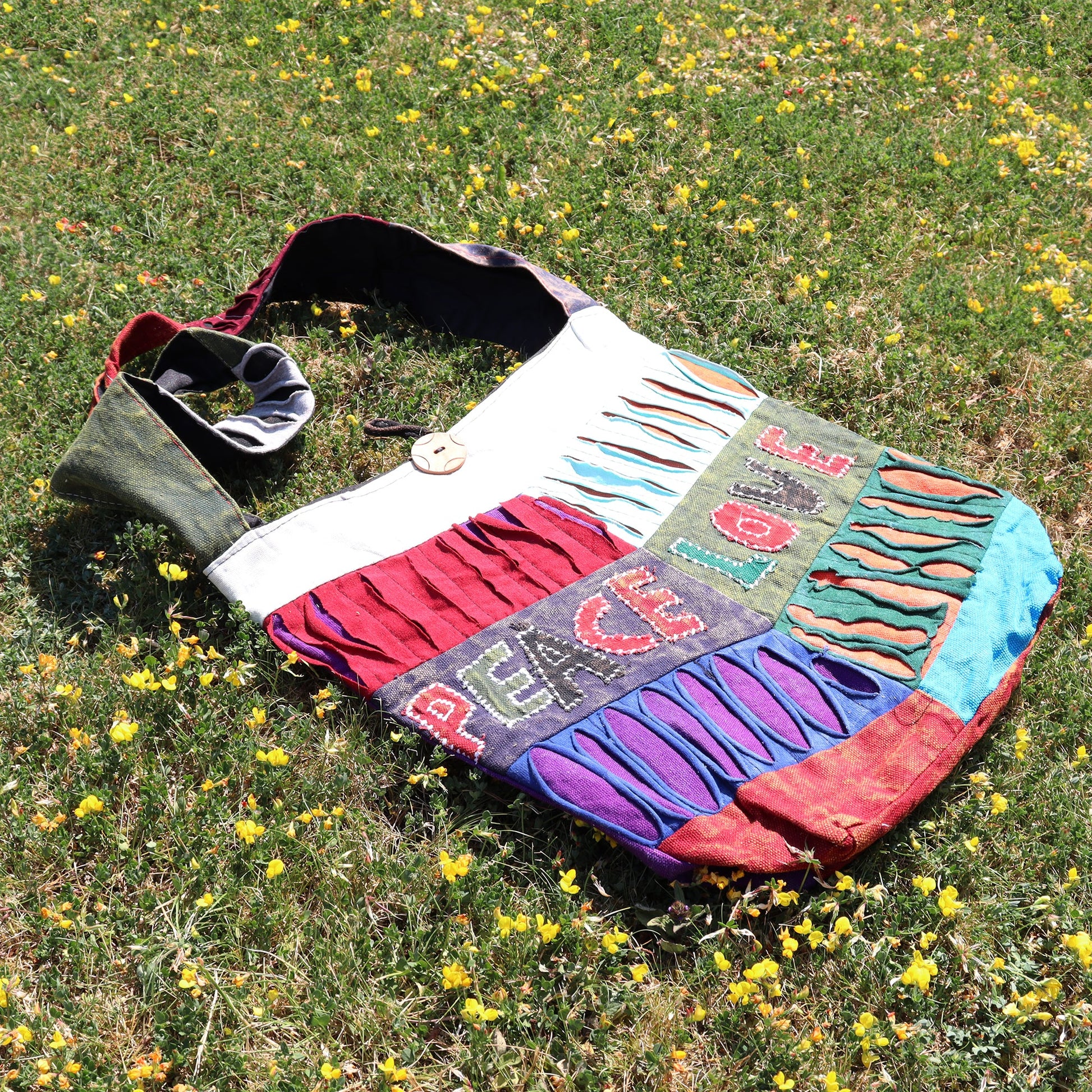 Handmade Indian Sling Bag - Peace and Love product packaging on clean background from Quintessential Holistic Health Ltd
