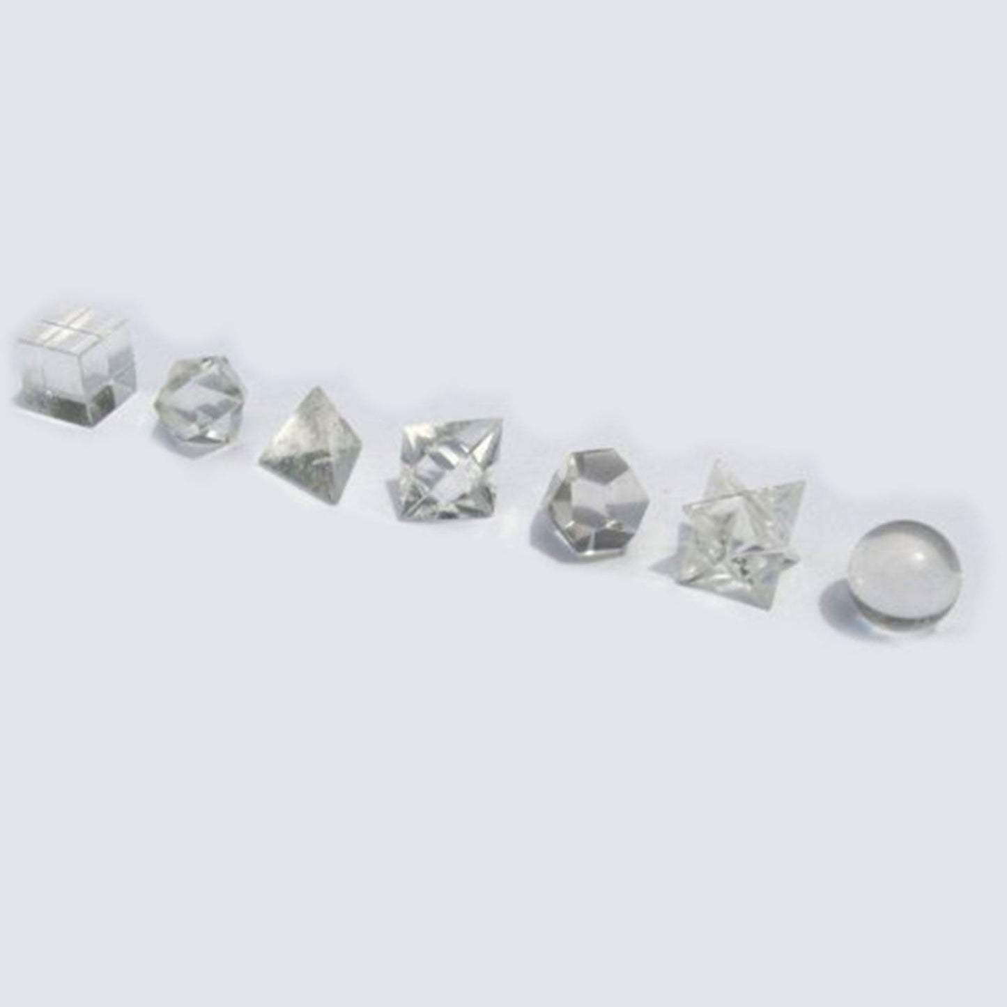 Geometric Seven Piece Crystal Set product packaging on clean background from Quintessential Holistic Health Ltd