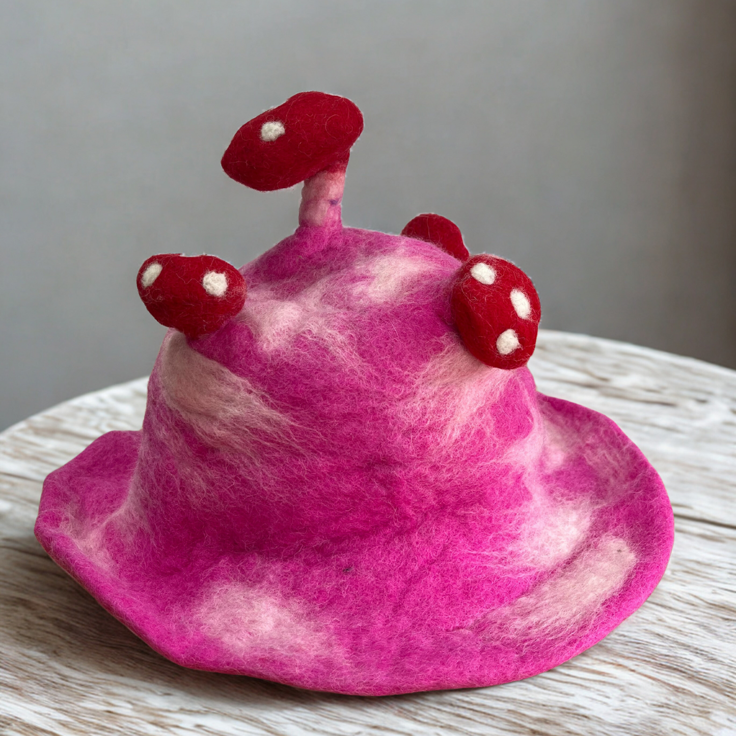 Wool Felted Handmade Mushroom Hat - Shocking Pink product packaging on clean background from Quintessential Holistic Health Ltd