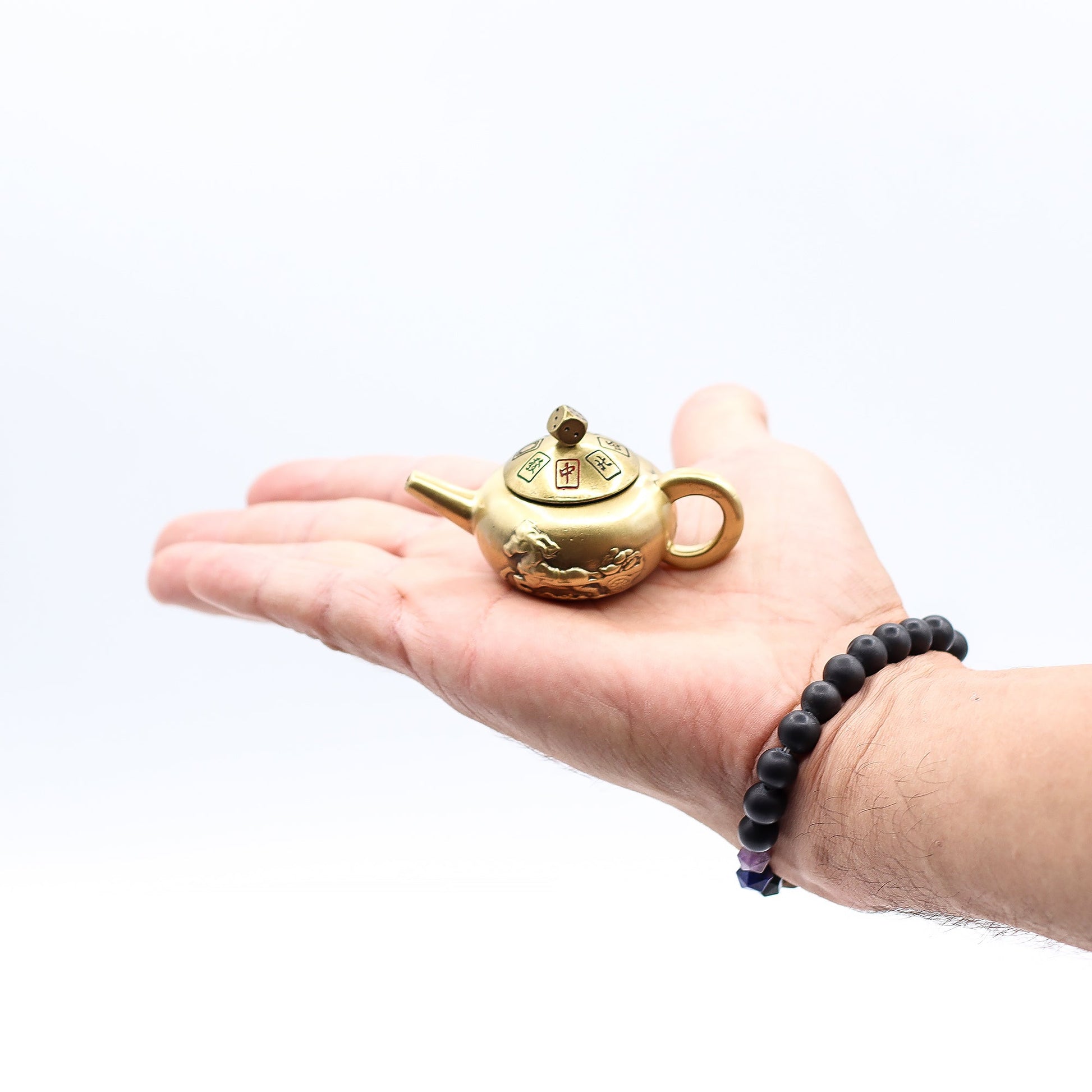 Feng Shui Fortune Spinner - Lucky Teapot with Dice product packaging on clean background from Quintessential Holistic Health Ltd