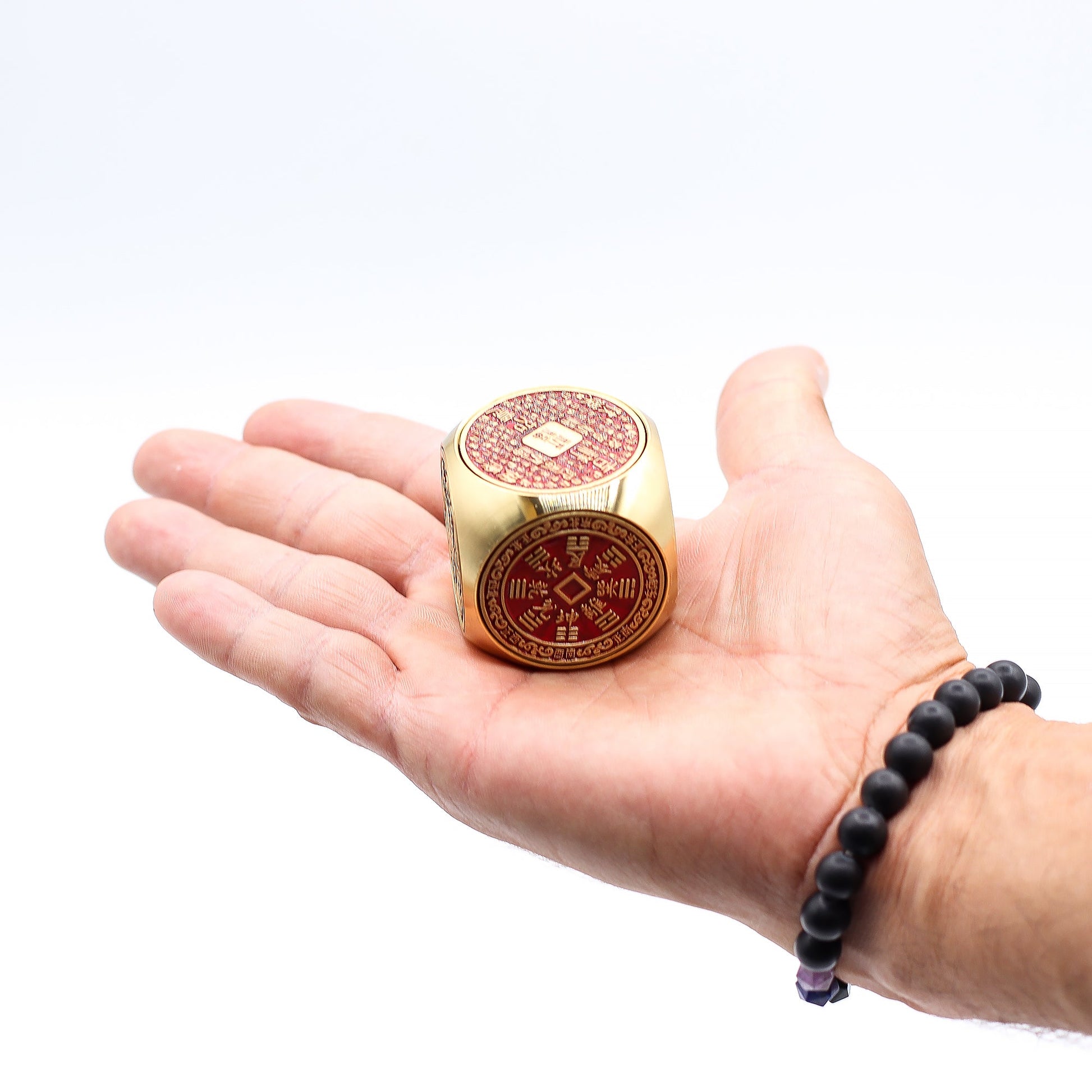 Feng Shui Fortune Spinner - Flat / Red and Brass Prosperity Cube product packaging on clean background from Quintessential Holistic Health Ltd