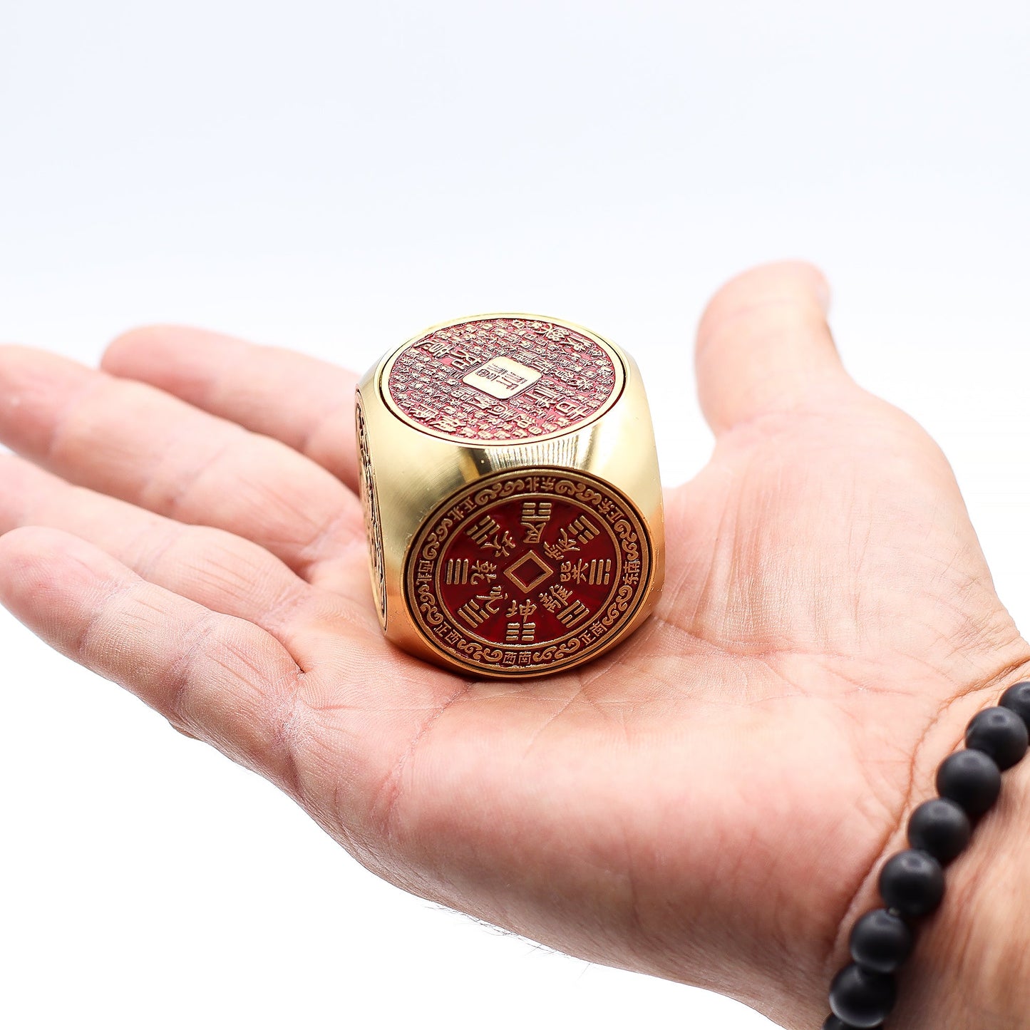 Feng Shui Fortune Spinner - Flat / Red and Brass Prosperity Cube product packaging on clean background from Quintessential Holistic Health Ltd