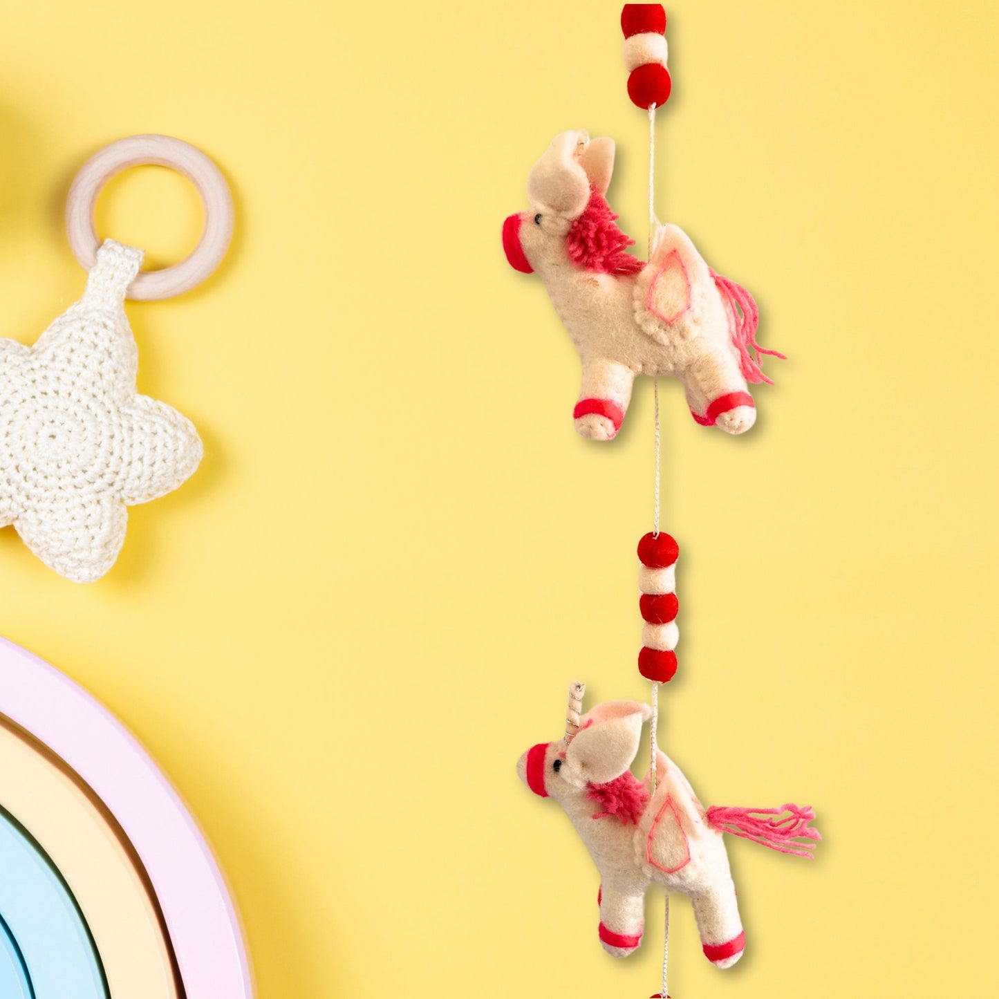 Handmade Childs Nursery Felt Wall or Ceiling Hanging - Unicorns product packaging on clean background from Quintessential Holistic Health Ltd