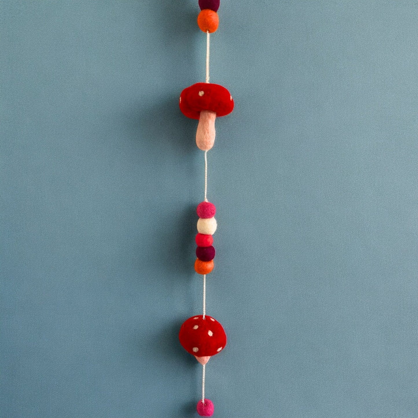 Handmade Childs Nursery Felt Wall or Ceiling Hanging - Red Mushrooms product packaging on clean background from Quintessential Holistic Health Ltd