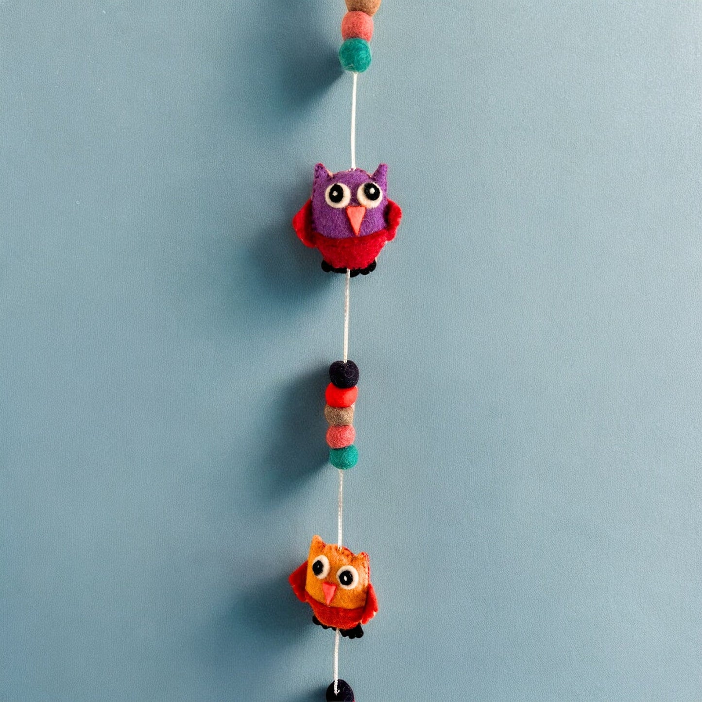 Handmade Childs Nursery Felt Wall or Ceiling Hanging - Owls / Random Colours product packaging on clean background from Quintessential Holistic Health Ltd