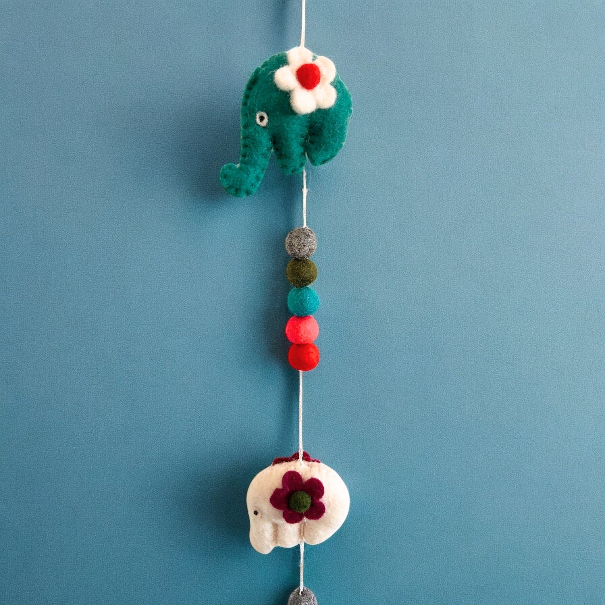 Handmade Childs Nursery Felt Wall or Ceiling Hanging - Elephants / Random Colours product packaging on clean background from Quintessential Holistic Health Ltd