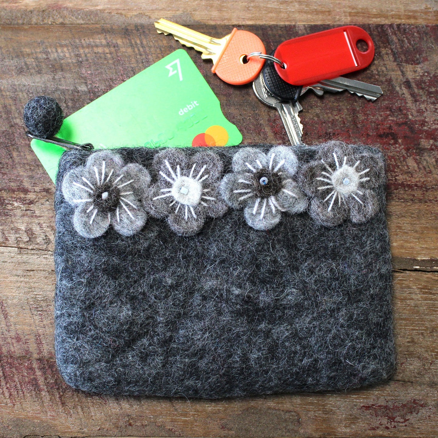Handmade Natural Felt Purse or Pouch with Zip - Assorted Colours / Four Flowers product packaging on clean background from Quintessential Holistic Health Ltd
