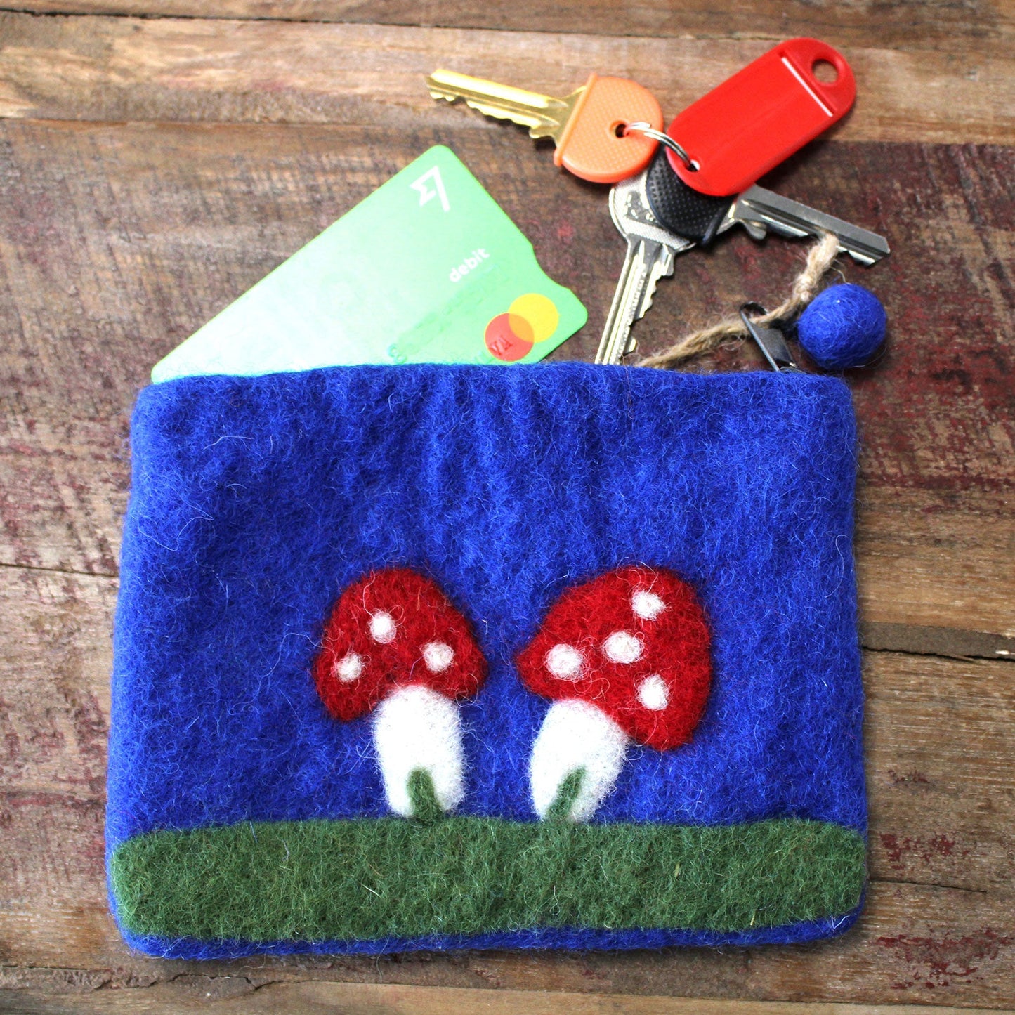 Handmade Natural Felt Purse or Pouch with Zip - Assorted Colours / Mystic Mushrooms product packaging on clean background from Quintessential Holistic Health Ltd