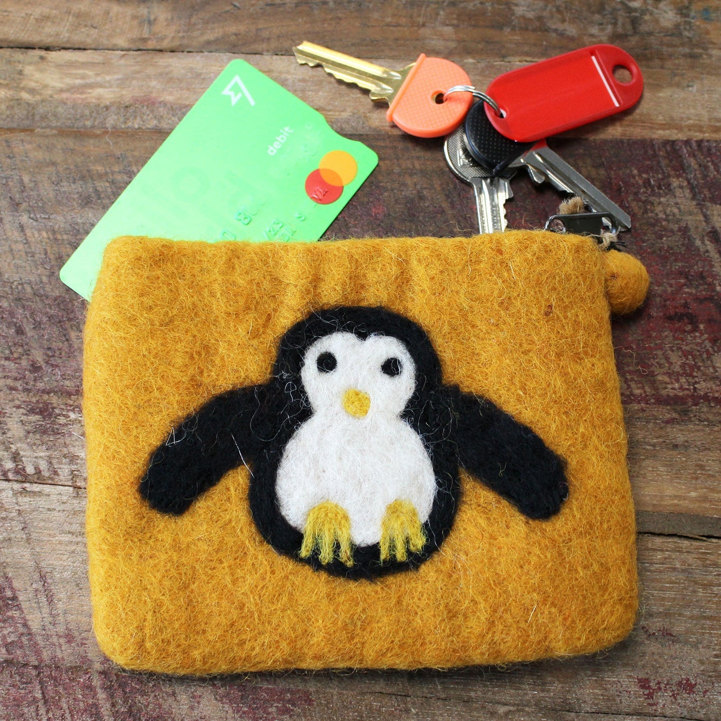 Handmade Natural Felt Purse or Pouch with Zip - Assorted Colours / Cute Penguin product packaging on clean background from Quintessential Holistic Health Ltd