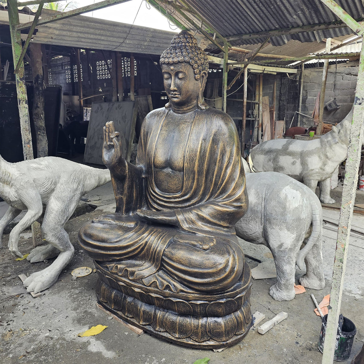 Fibre Cement Teaching Lotus Buddha - Antique Gold, 2 m, seated on a lotus pedestal among animal statues by Quintessential Holistic Health Ltd