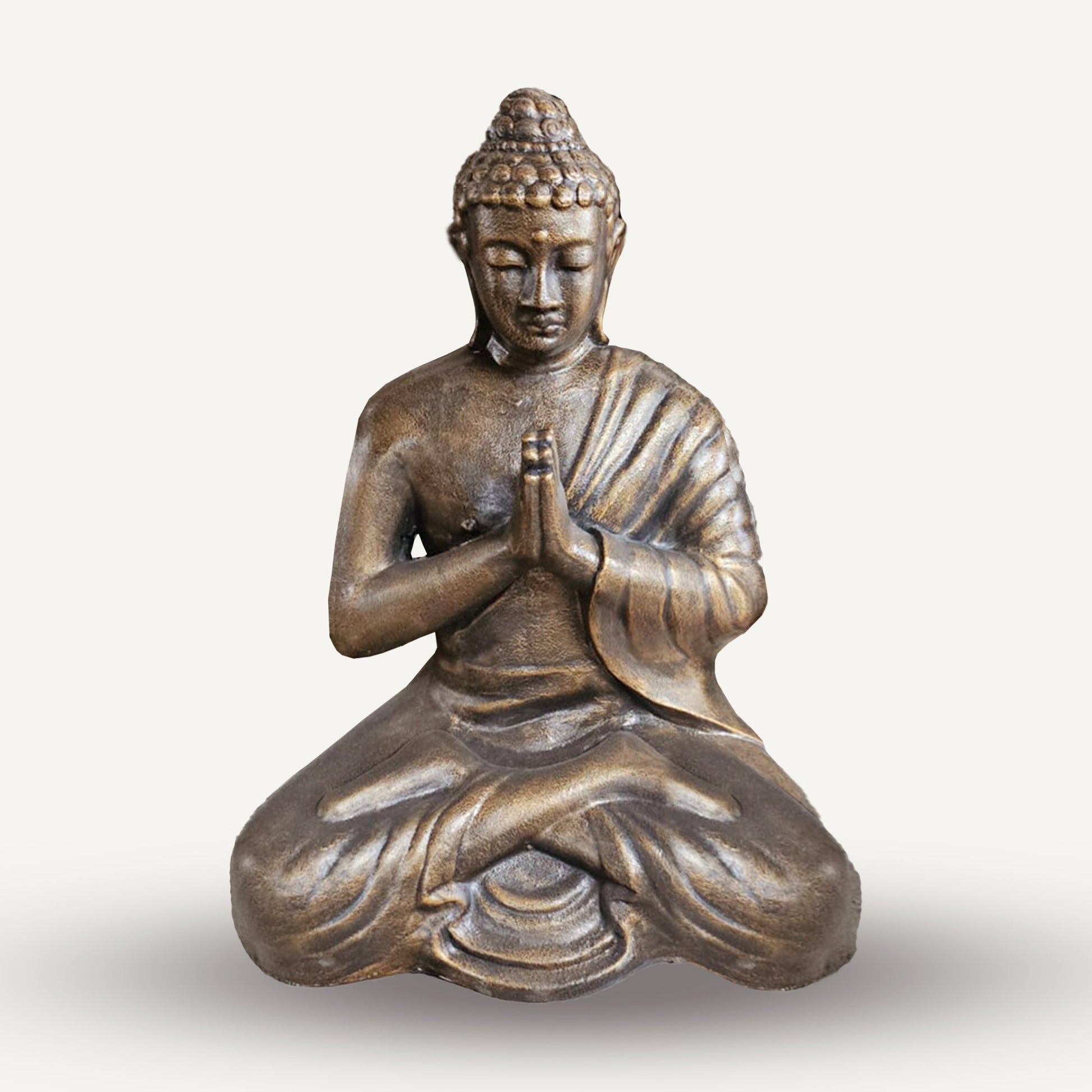 Small 1.2 m Antique Gold Praying Buddha Statue depicting a seated figure with hands together, curled hair and deeply folded robes by Quintessential Holistic Health Ltd