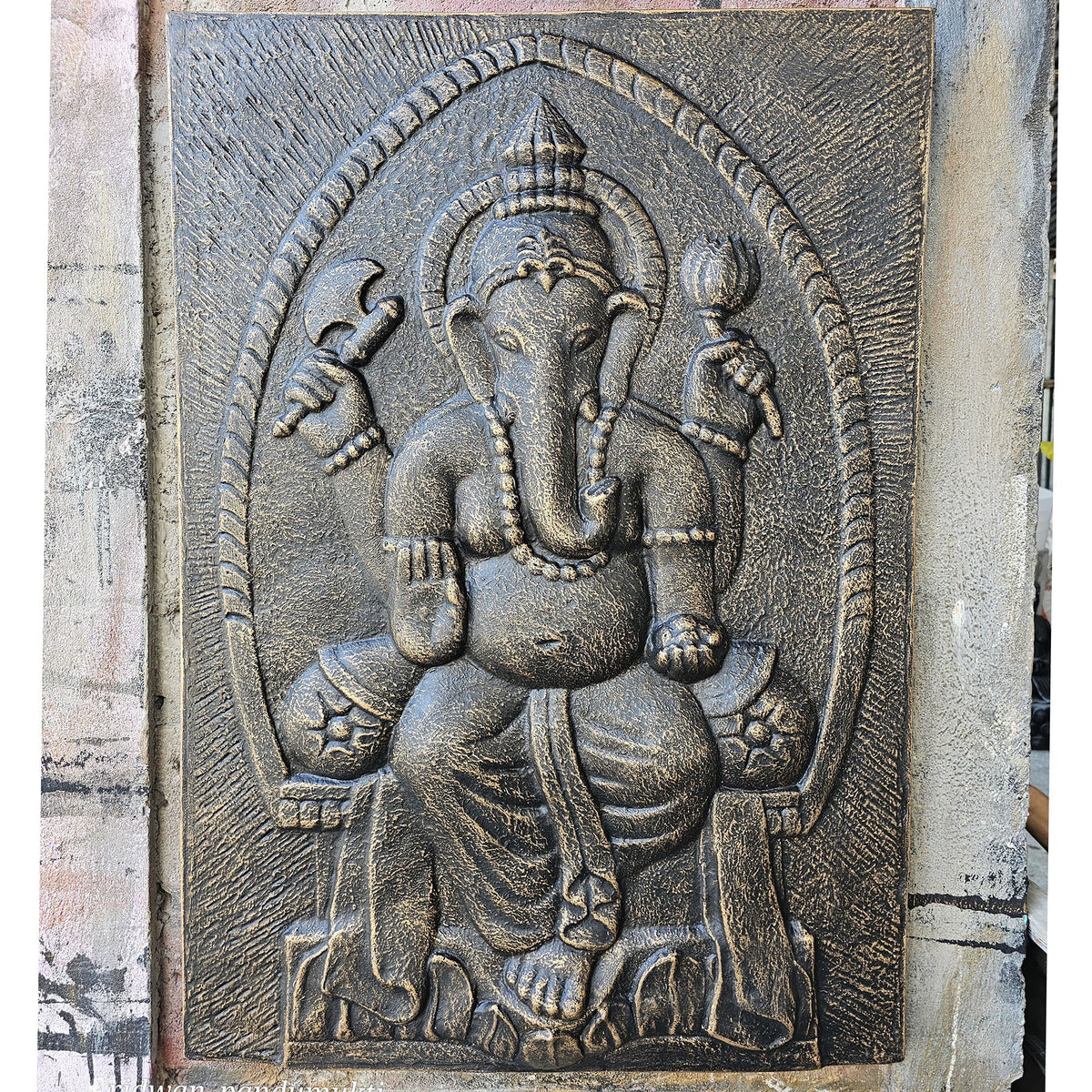 Handmade Fibre Cement Ganesh Wall Plaque - Antique Gold with an ornate raised Ganesh design and weathered textured border by Quintessential Holistic Health Ltd