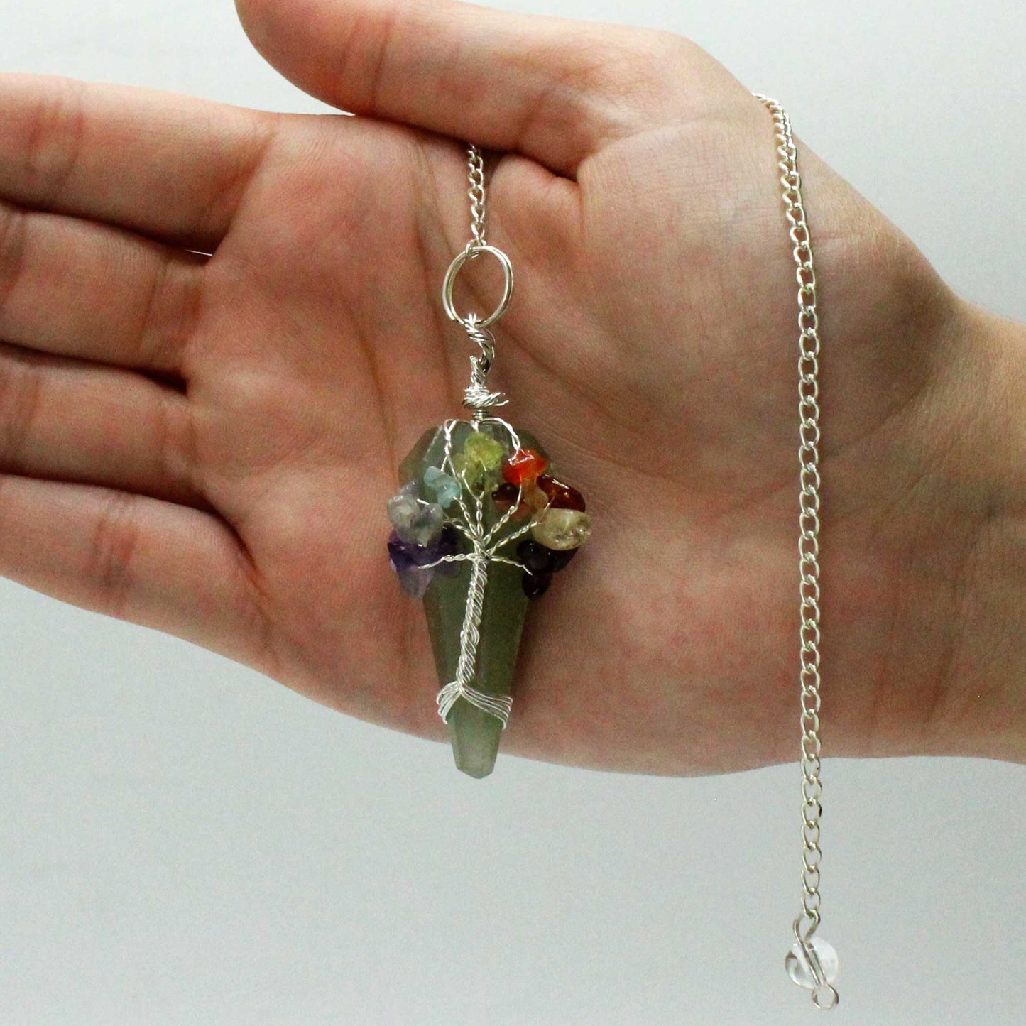1 x Handmade Magic Radiesthesia Pendulum Seven Chakra - Green Aventurine Gemstone product packaging on clean background from Quintessential Holistic Health Ltd