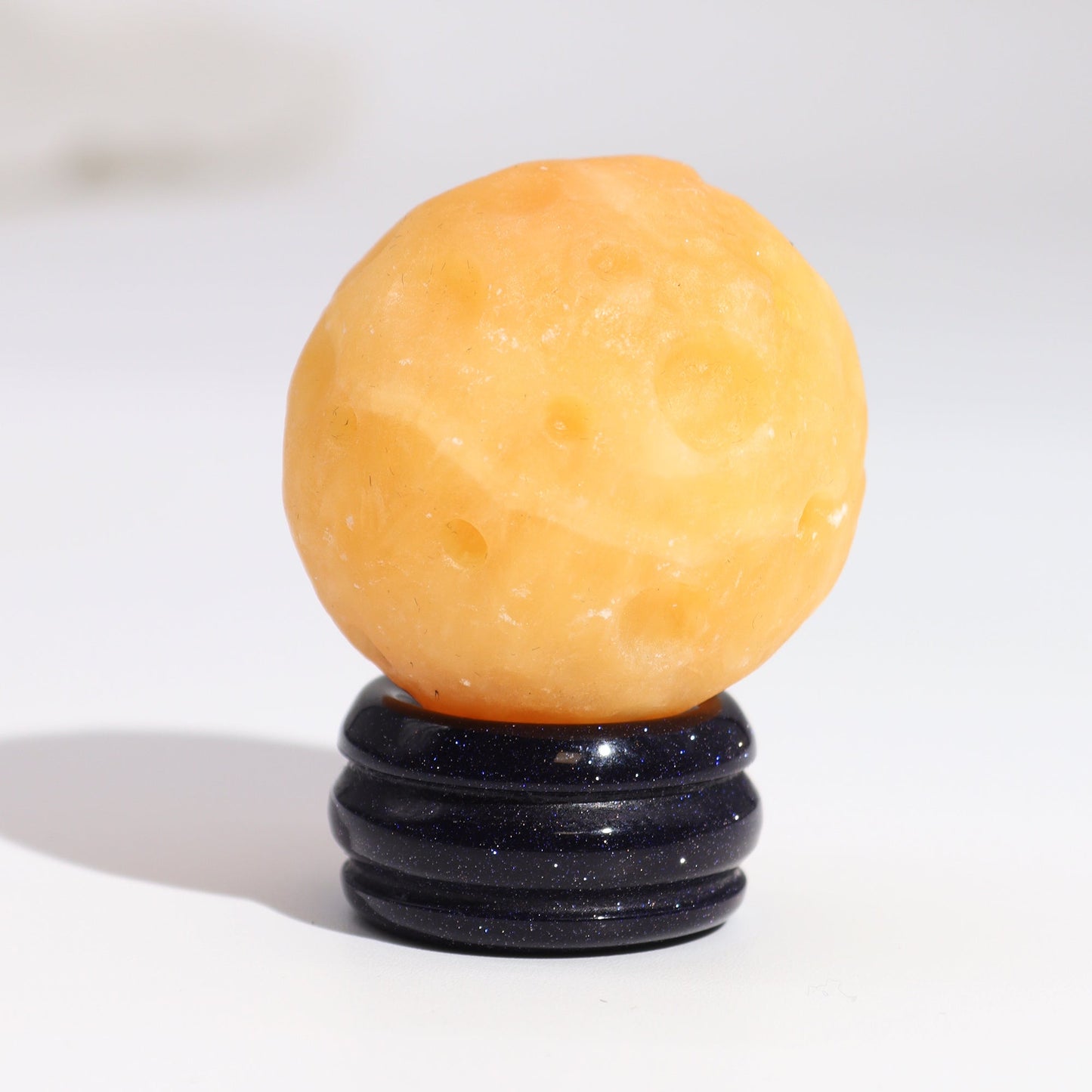 Yellow Jade Gemstone Planet and Goldstone Stand - Saturn product packaging on clean background from Quintessential Holistic Health Ltd